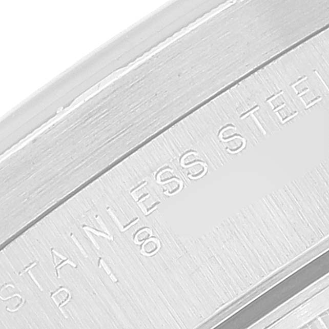 This close-up shows the stainless steel band of a Rolex Date 15210 Men's Stainless Steel Blue Dial 15210 Men's Stainless Steel Blue Dial watch, highlighting the engraved text.