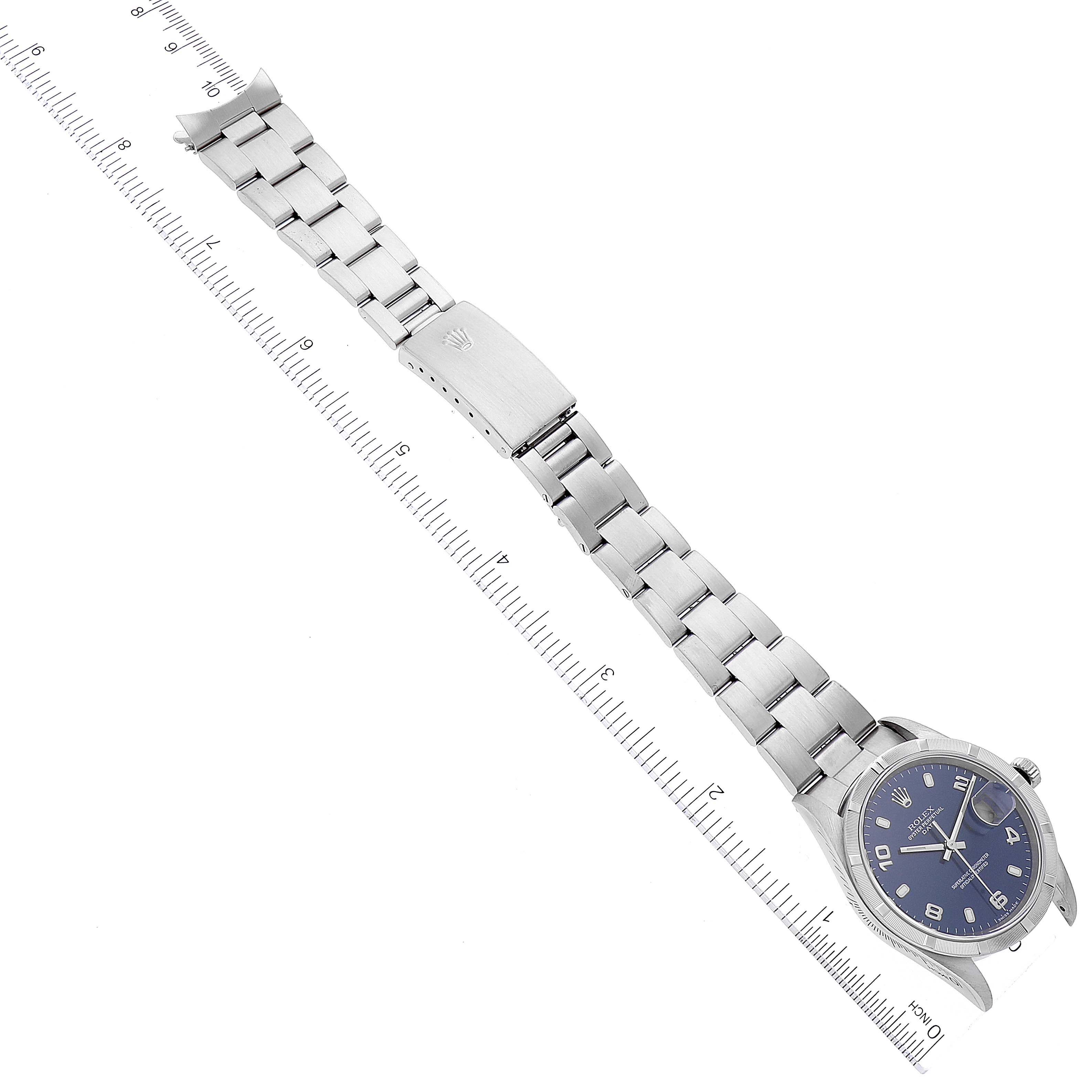 The image shows the full length of a Rolex Date 15210 Men's Stainless Steel Blue Dial 15210 Men's Stainless Steel Blue Dial model watch laid flat, viewed from above, with the face, band, and clasp visible.