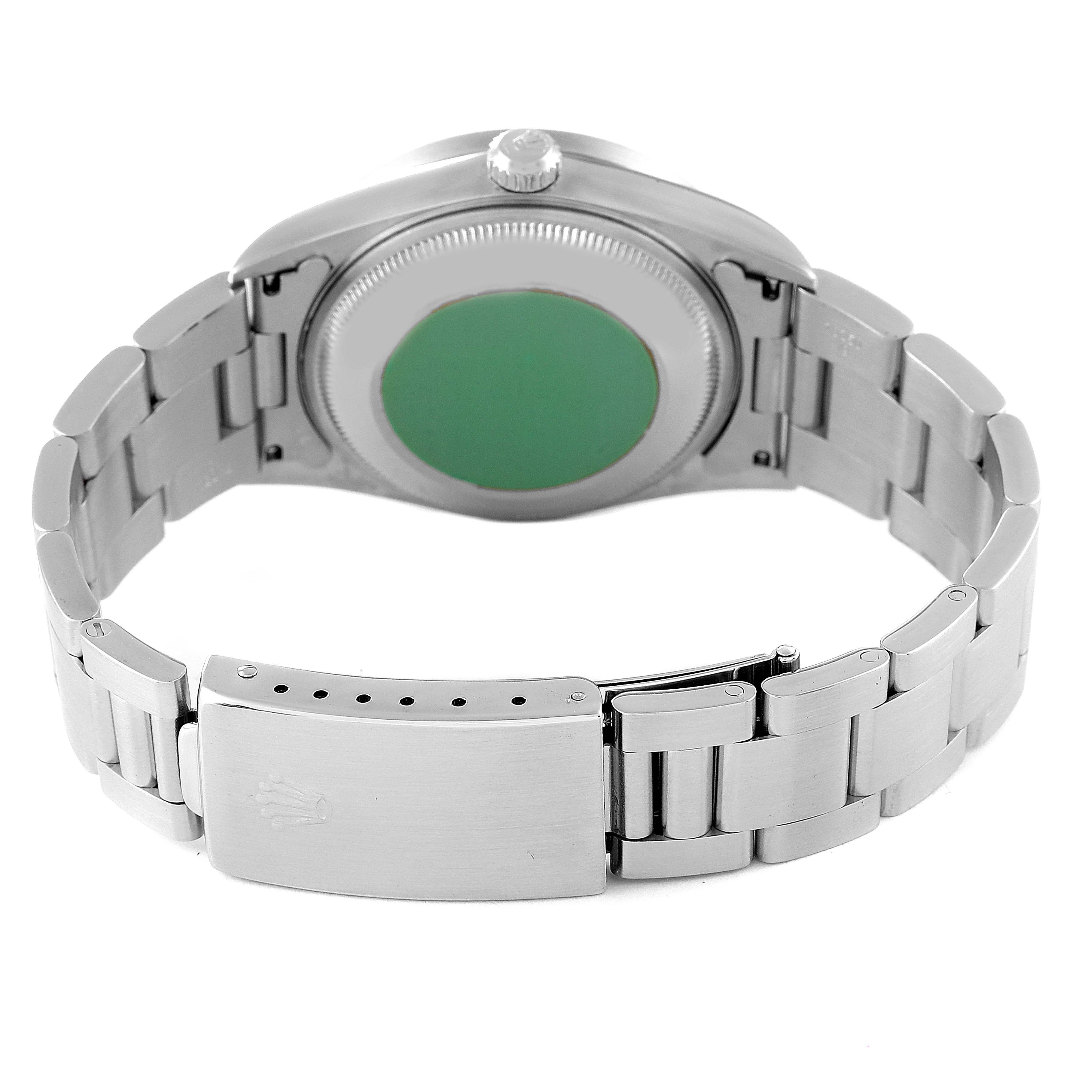 This image shows the back case and bracelet of a Rolex Date 15210 Men's Stainless Steel Blue Dial 15210 Men's Stainless Steel Blue Dial model watch.