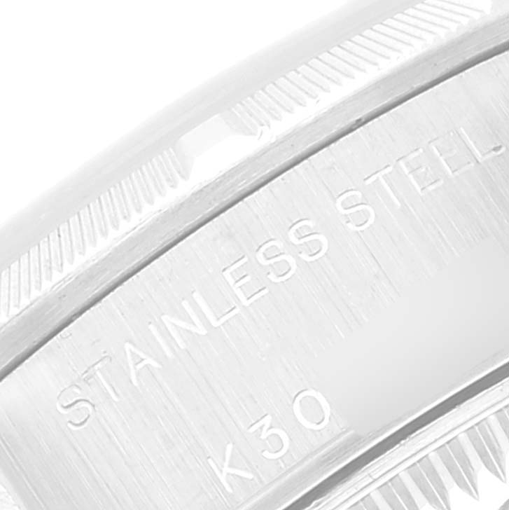 The image shows a close-up of the stainless steel casing with engraved text of the Rolex Date 79190 Women's Stainless Steel Pink Dial 79190 Women's Stainless Steel Pink Dial model watch.