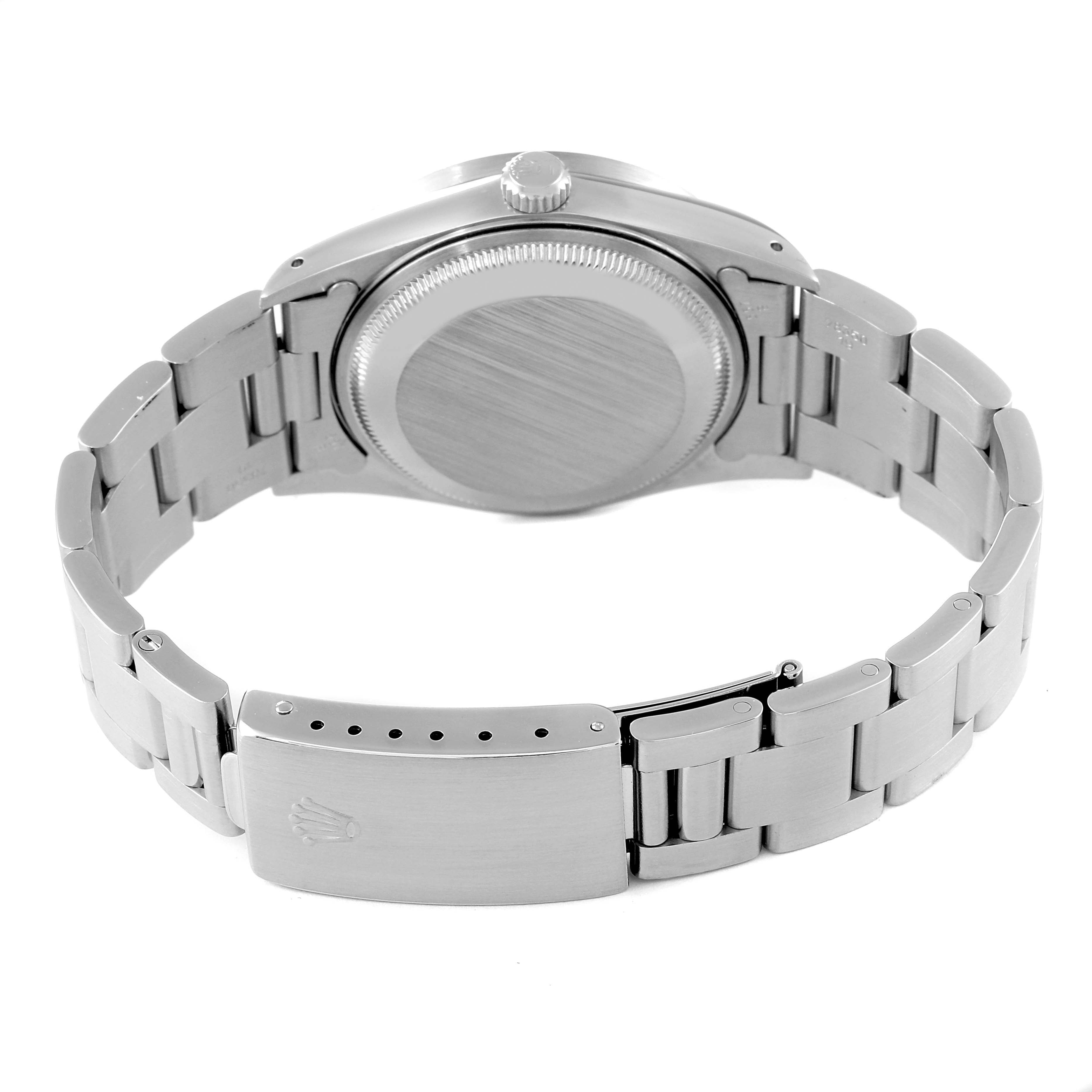 The image shows the back view of a Rolex Date 15210 Men's Stainless Steel Silver Dial 15210 Men's Stainless Steel Silver Dial model watch, highlighting its bracelet, clasp, and case back.