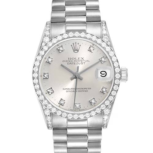 The image shows a Rolex Datejust President model watch with a diamond-encrusted bezel, silver dial, date display, and metal bracelet.