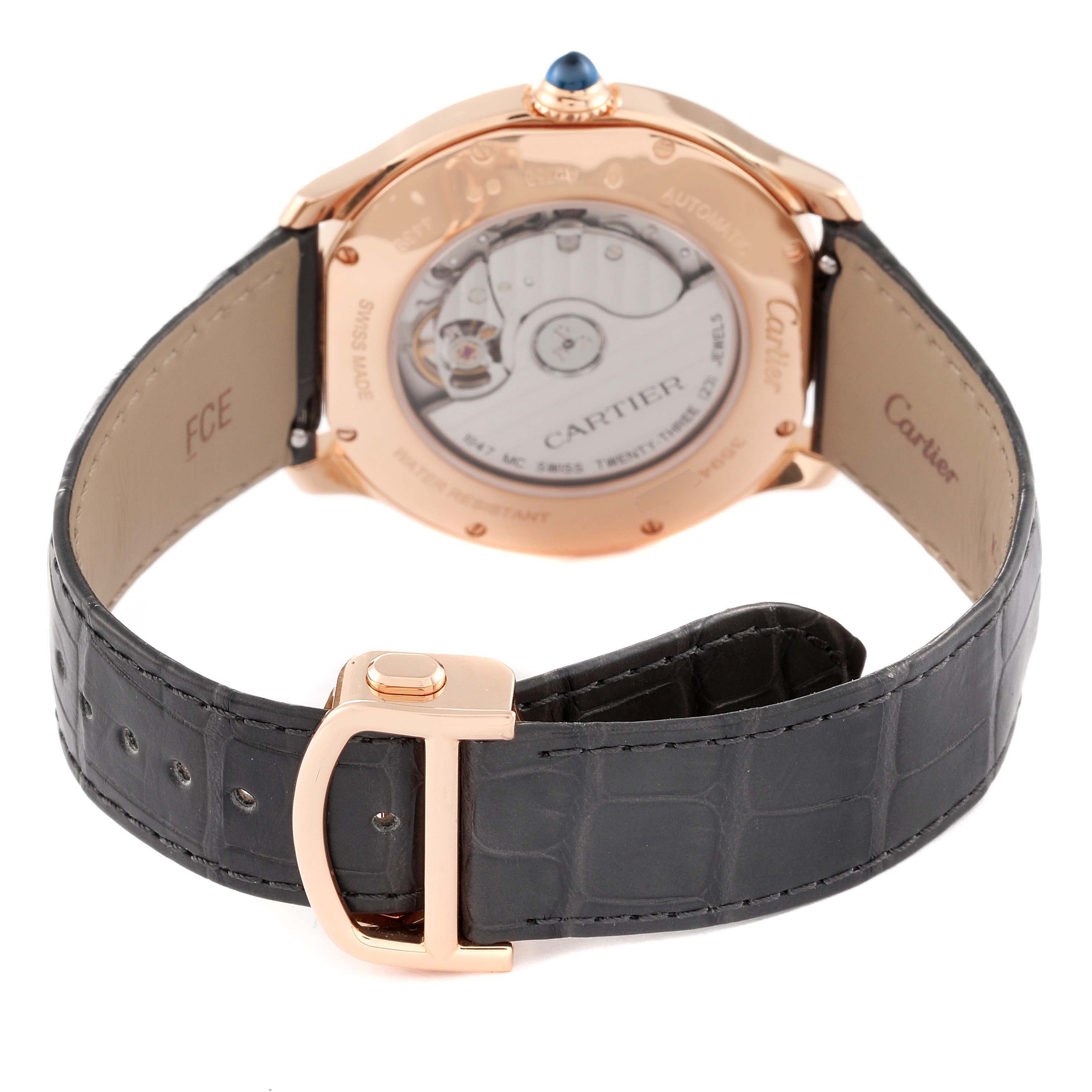 The image shows the back of a Cartier Ronde WGRN0011 Men's Rose Gold Silver Dial WGRN0011 Men's Rose Gold Silver Dial watch, highlighting the strap, buckle, and transparent case back.