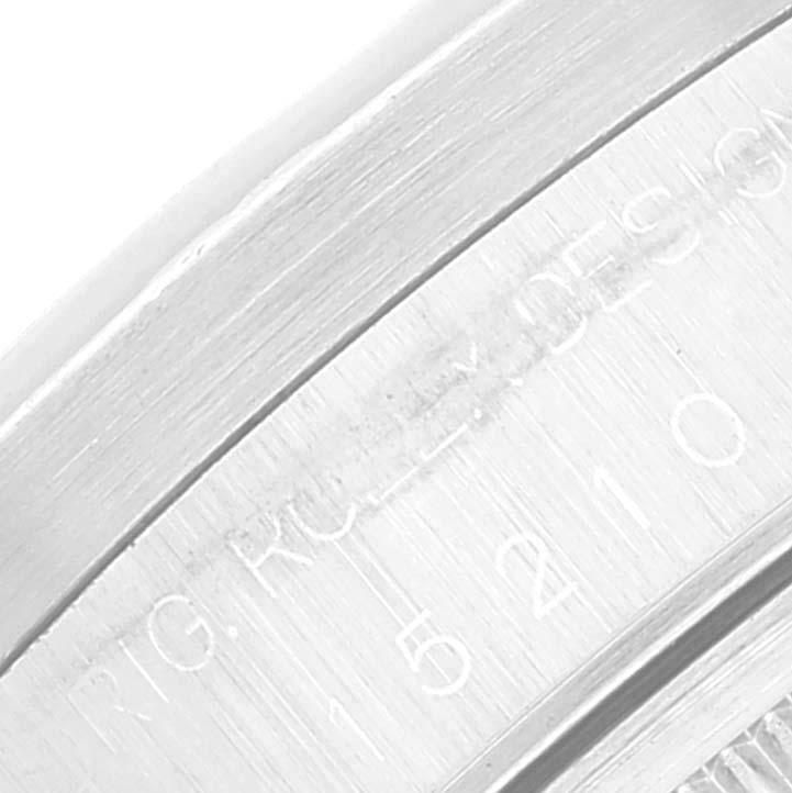 This close-up image shows the side engraving on the watch case edge of a Rolex Date 15210 Men's Stainless Steel Black Dial 15210 Men's Stainless Steel Black Dial model.
