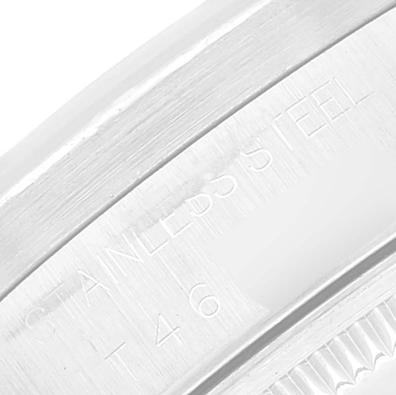 Close-up of the stainless steel case side of a Rolex Date 15210 Men's Stainless Steel Black Dial 15210 Men's Stainless Steel Black Dial model watch showing engraved text.