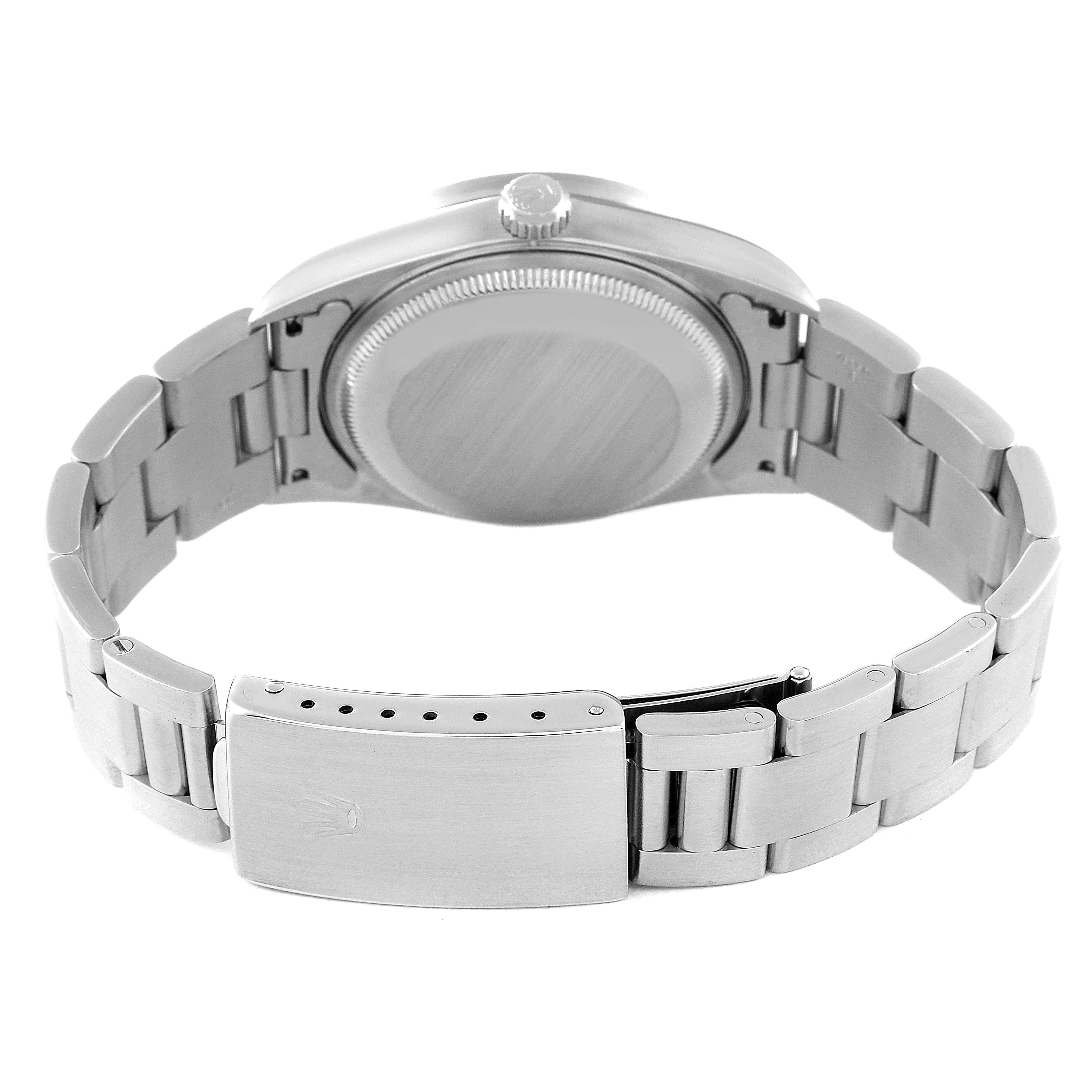 This image shows the Rolex Date 15210 Men's Stainless Steel Black Dial 15210 Men's Stainless Steel Black Dial watch from the back, featuring the case, crown, and bracelet clasp.