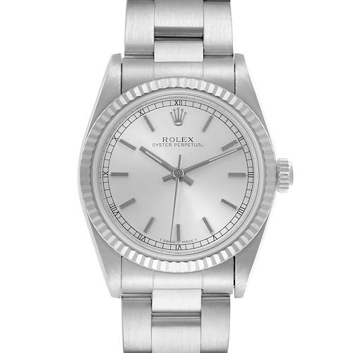 The Rolex Oyster Perpetual Mid-Size watch is shown from a front angle, displaying its face, bezel, and bracelet.
