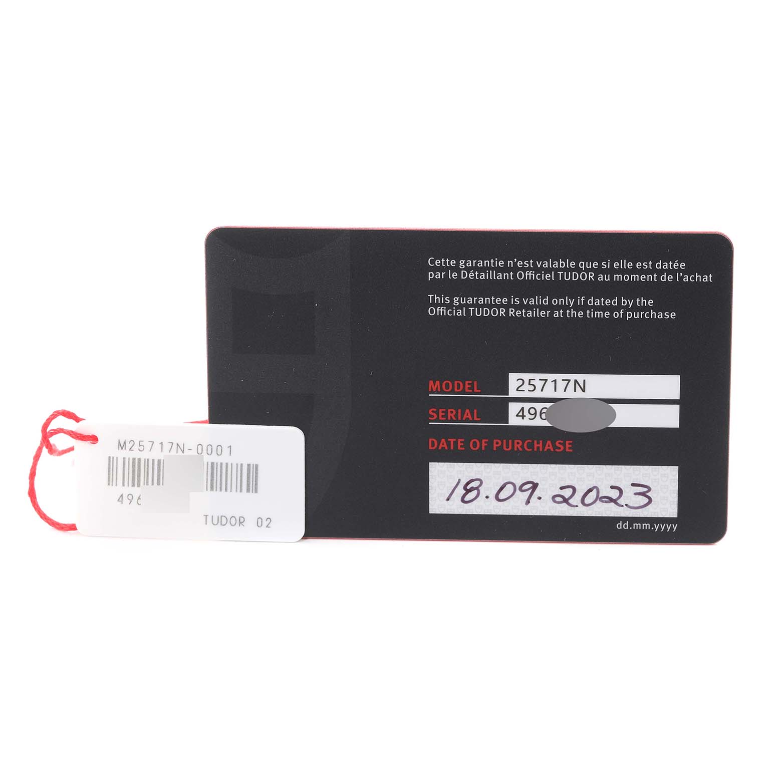 The image shows the warranty card and tag for a Tudor Pelagos M25717N-0001 Men's Titanium Black Dial M25717N-0001 Men's Titanium Black Dial model 25717N.