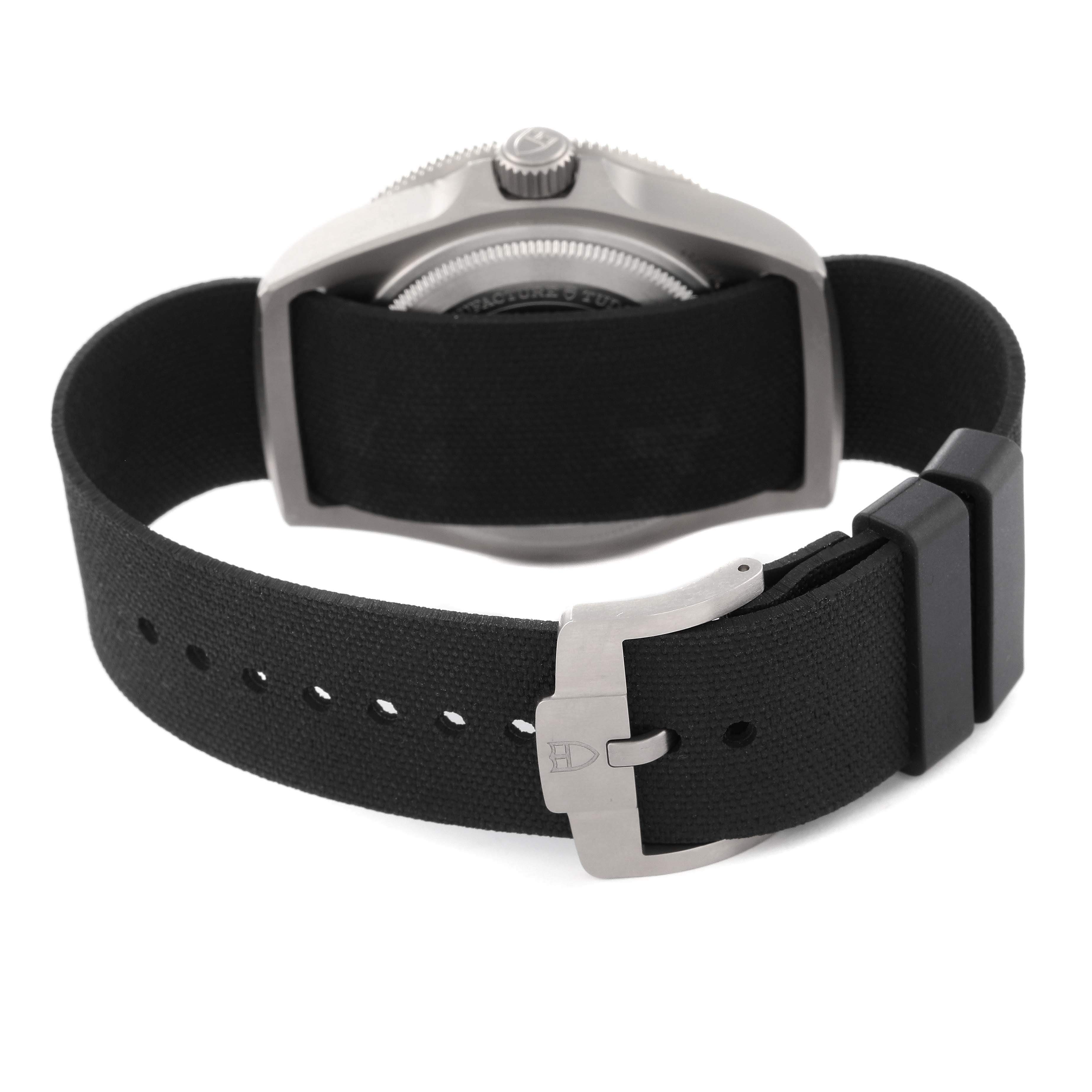 The image shows the back view of the Tudor Pelagos M25717N-0001 Men's Titanium Black Dial M25717N-0001 Men's Titanium Black Dial watch, focusing on the case back, strap, and buckle.