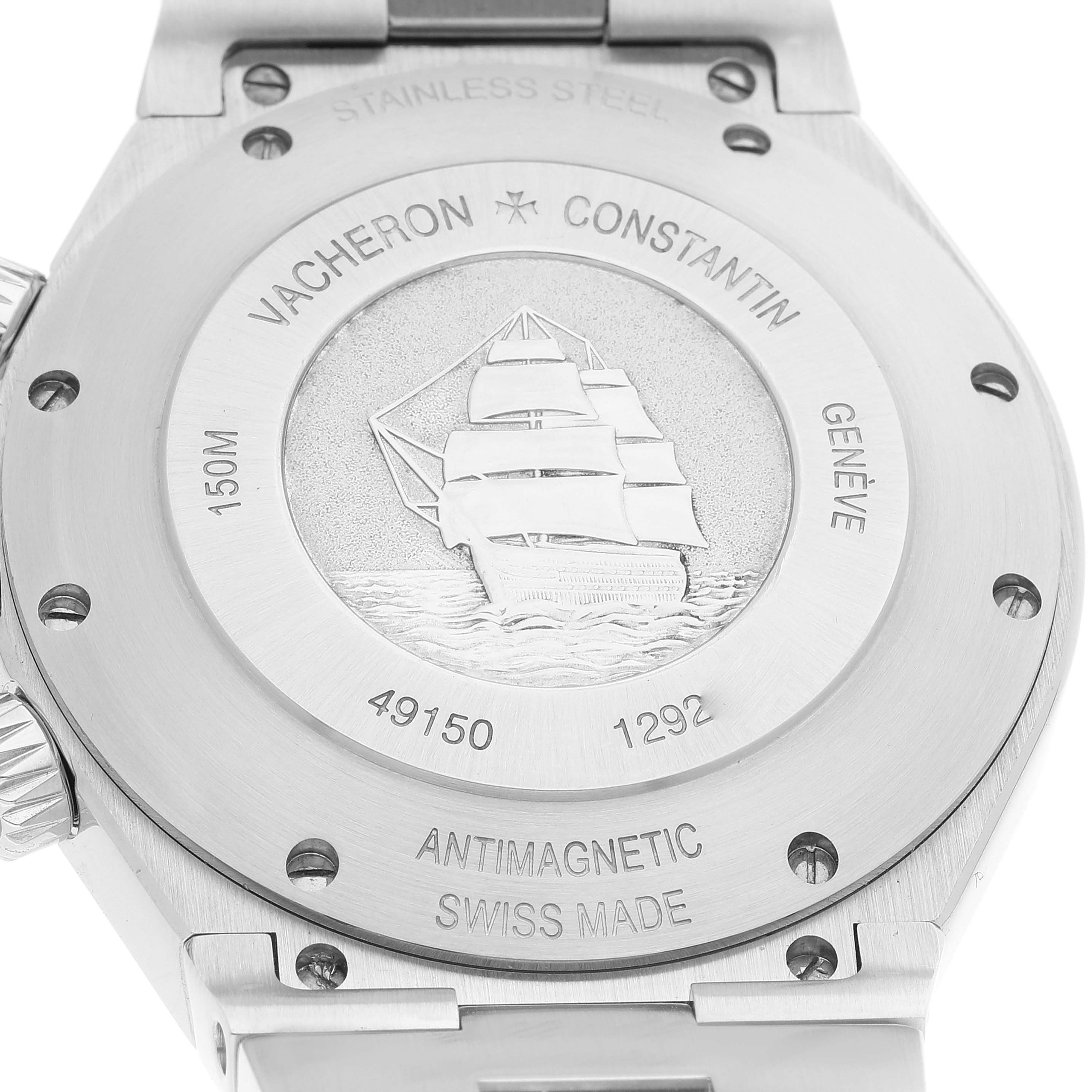 The image shows the case back of the Vacheron Constantin Overseas 49150/B01A-9095 Men's Stainless Steel Silver Dial 49150/B01A-9095 Men's Stainless Steel Silver Dial watch, featuring an engraved ship motif and various inscriptions.