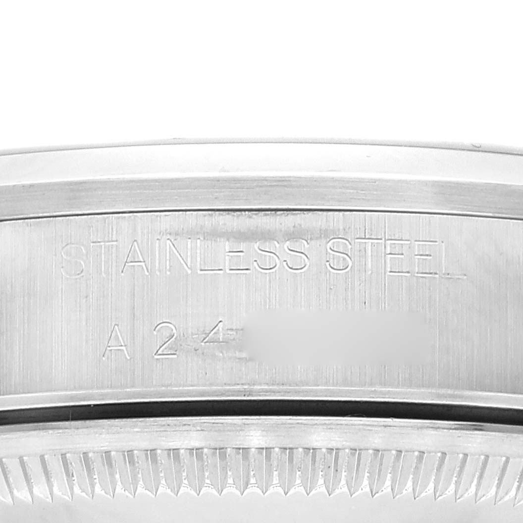 The image shows a close-up shot of the case back and serial number area of a Rolex Date 15200 Men's Stainless Steel Blue Dial 15200 Men's Stainless Steel Blue Dial model watch.