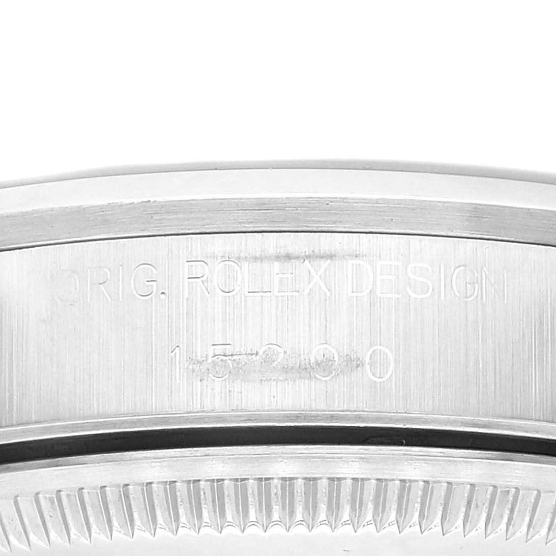 This image shows a close-up of the case side and case back edge of a Rolex Date 15200 Men's Stainless Steel Blue Dial 15200 Men's Stainless Steel Blue Dial model watch, focusing on the engravings.