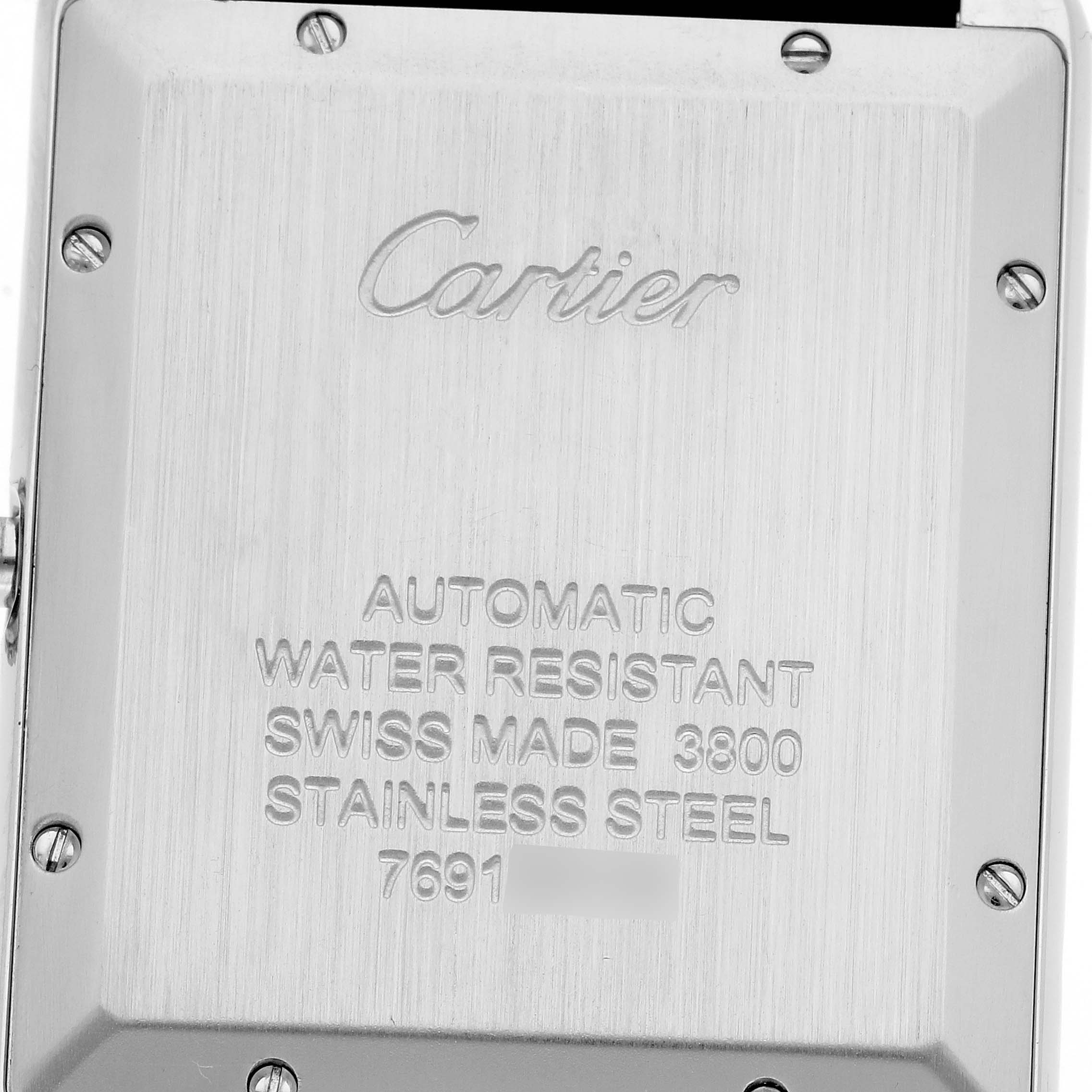 The image shows the back case of the Cartier Tank Solo W5200027 Men's Stainless Steel Silver Dial W5200027 Men's Stainless Steel Silver Dial, featuring engravings and screws.