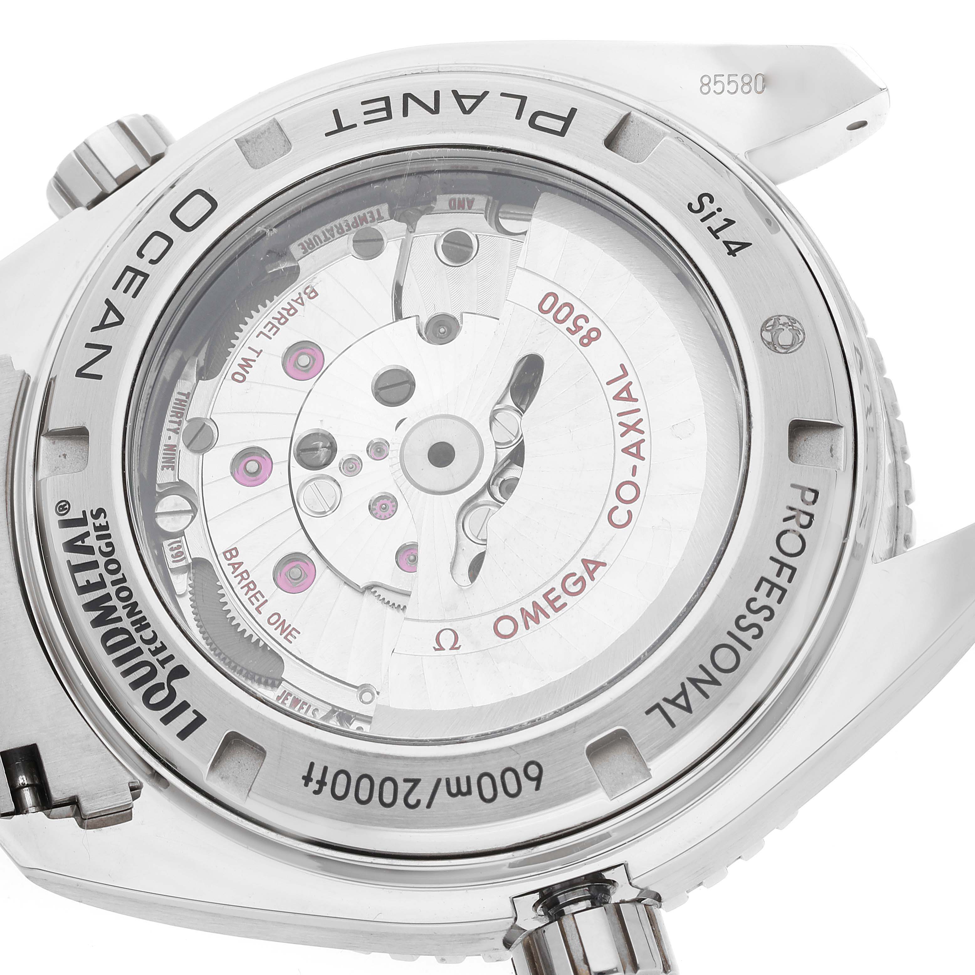 The image shows an angled view of the Omega Planet Ocean 232.90.46.21.03.001 Men's Titanium Blue Dial 232.90.46.21.03.001 Men's Titanium Blue Dial watch's transparent case back, revealing its internal mechanism.