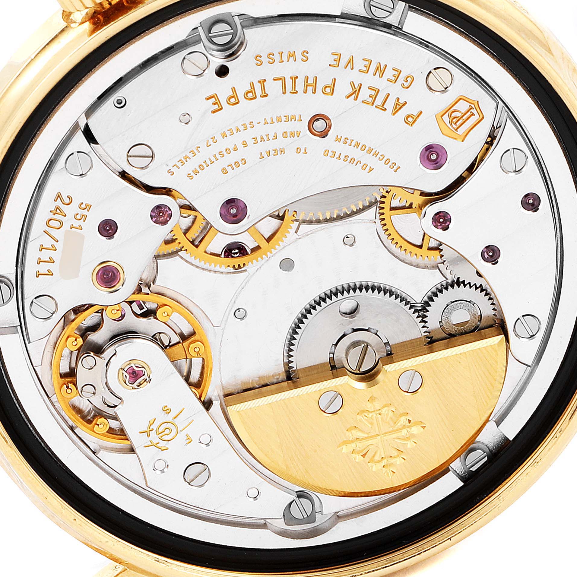 The image shows a close-up of the intricate internal mechanism of the Patek Philippe Calatrava 5120J Men's Yellow Gold White Dial 5120J Men's Yellow Gold White Dial watch from the backside.