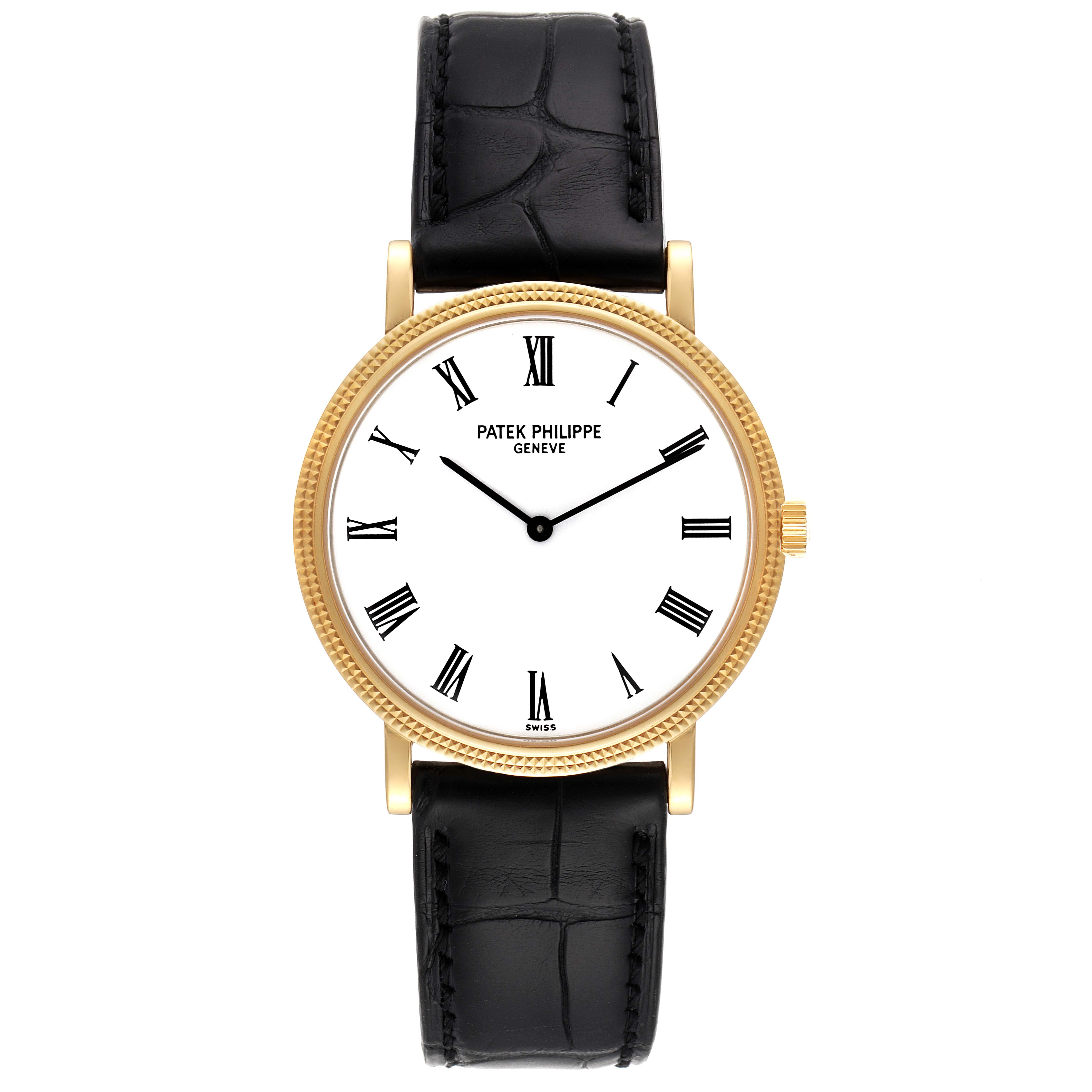 The image shows the front view of a Patek Philippe Calatrava 5120J Men's Yellow Gold White Dial 5120J Men's Yellow Gold White Dial watch with a gold case and black leather strap.