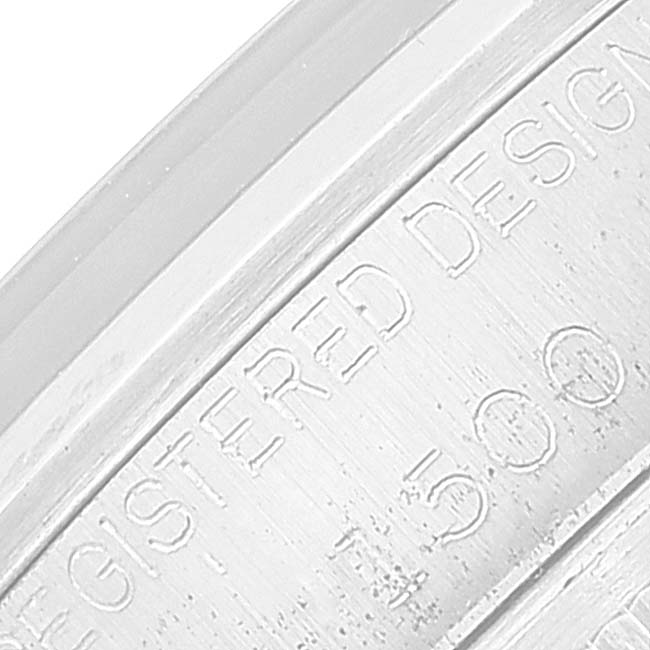 This is a close-up of the engraved inner bezel of a Rolex Date 1500 Men's Stainless Steel Silver Dial 1500 Men's Stainless Steel Silver Dial model watch.