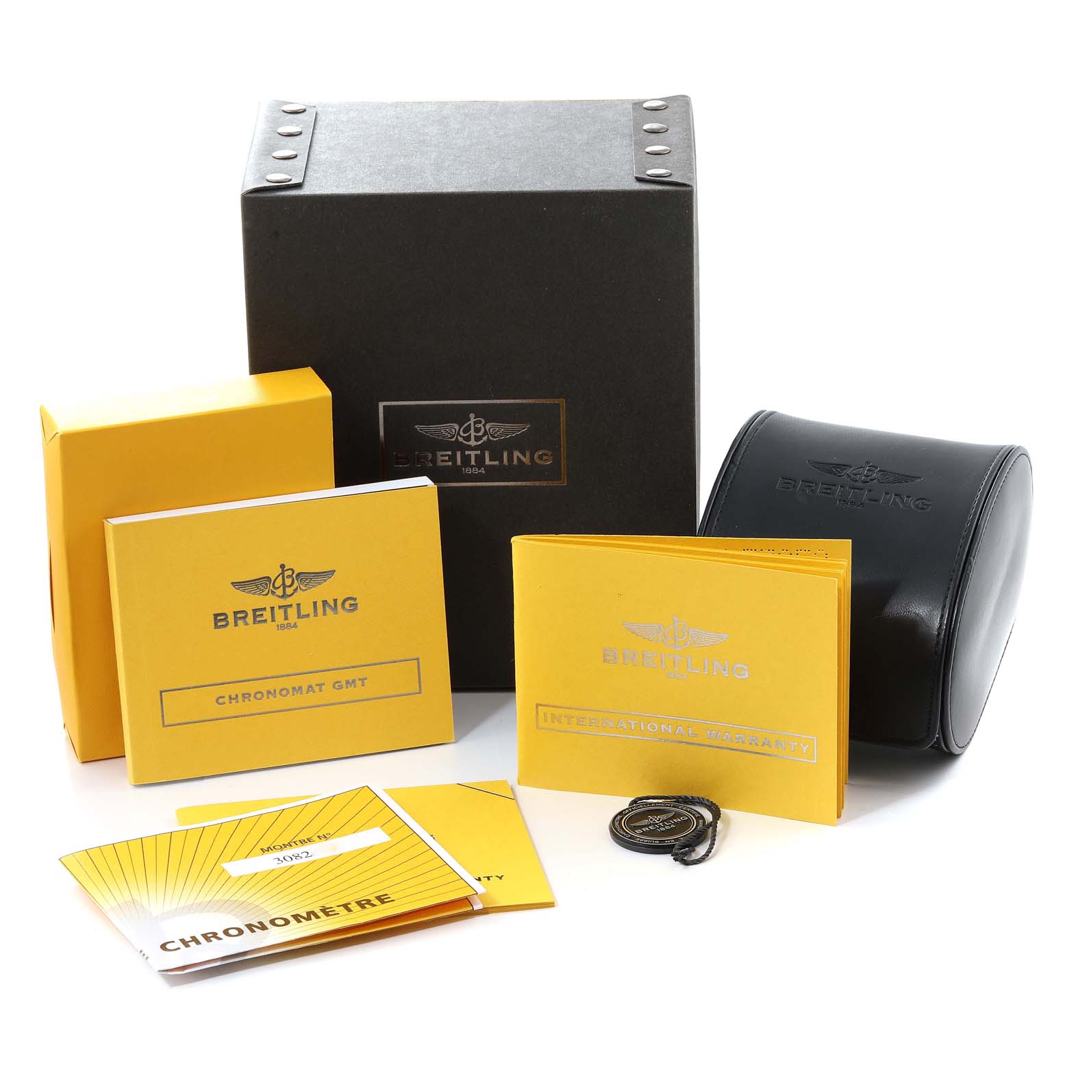 The image shows the packaging, boxes, booklets, and accessories for a Breitling Chronomat AB0410 Men's Stainless Steel Silver Dial AB0410 Men's Stainless Steel Silver Dial model watch from a front angle.