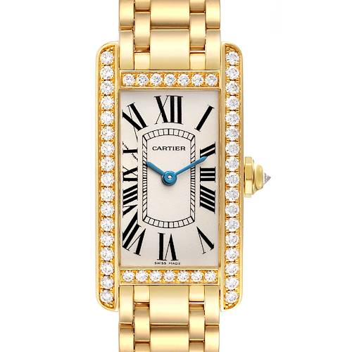 The image shows a front view of a Cartier Tank Americaine WB7072K2 Women's Yellow Gold Silver Dial WB7072K2 Women's Yellow Gold Silver Dial watch with a gold bracelet and diamond-set bezel.