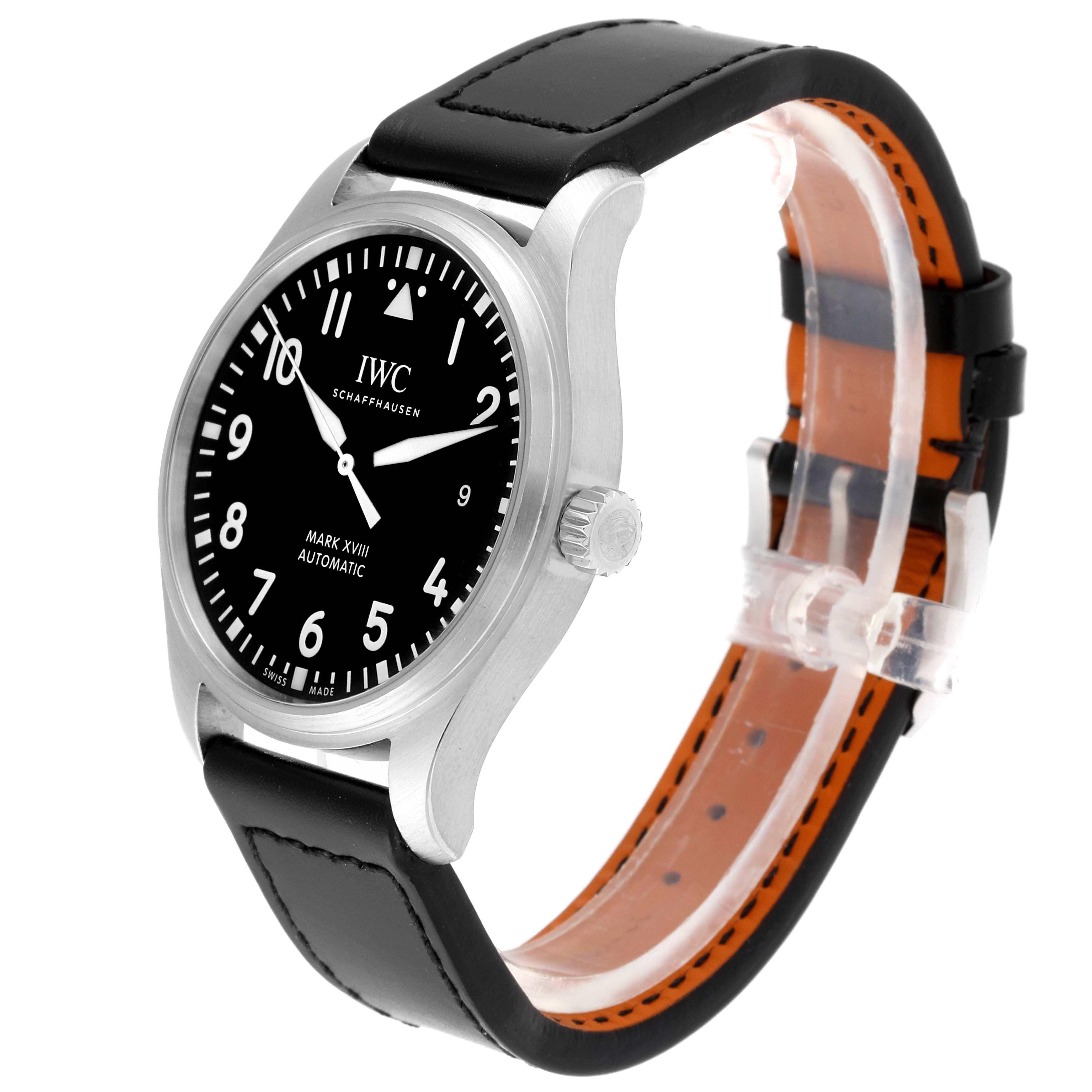 The image shows the IWC Pilot IW327001 Men's Stainless Steel Black Dial IW327001 Men's Stainless Steel Black Dial Mark XVIII watch at a three-quarter angle, highlighting the black dial, case, and leather strap.