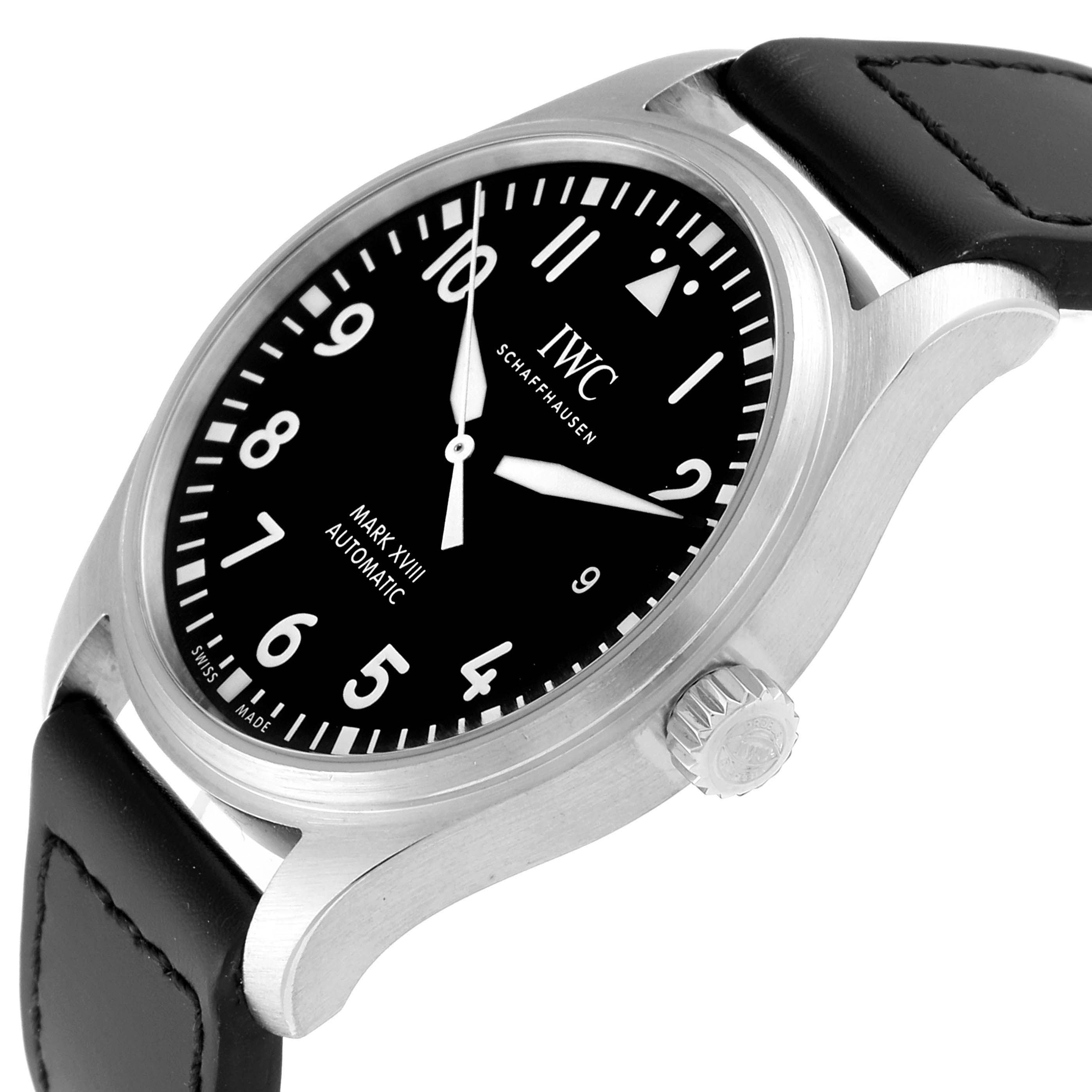The image shows an oblique view of the IWC Pilot IW327001 Men's Stainless Steel Black Dial IW327001 Men's Stainless Steel Black Dial's Watch Mark XVIII, highlighting the dial, bezel, crown, and leather strap.