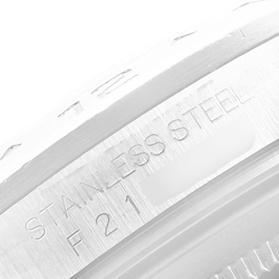 This is a close-up of the stainless steel case back edge showing engraved markings on a Rolex Explorer 16570 Men's Stainless Steel White Dial 16570 Men's Stainless Steel White Dial watch.