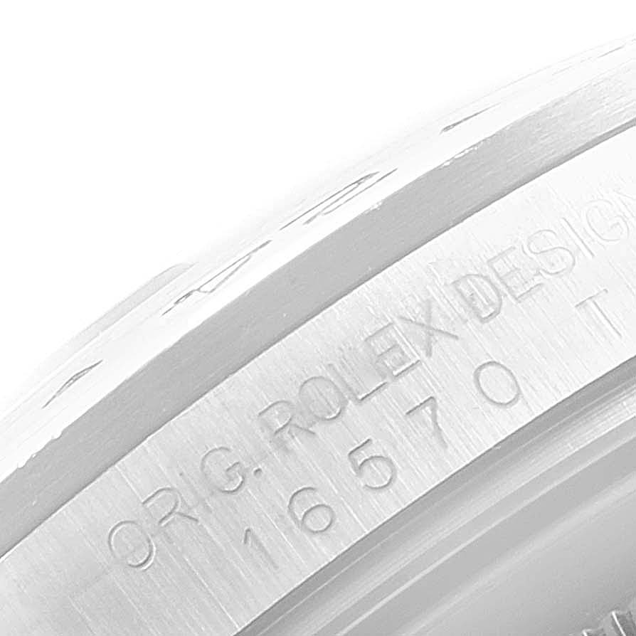 The image shows a close-up of the side engravings on a Rolex Explorer 16570 Men's Stainless Steel White Dial 16570 Men's Stainless Steel White Dial watch model 16570.