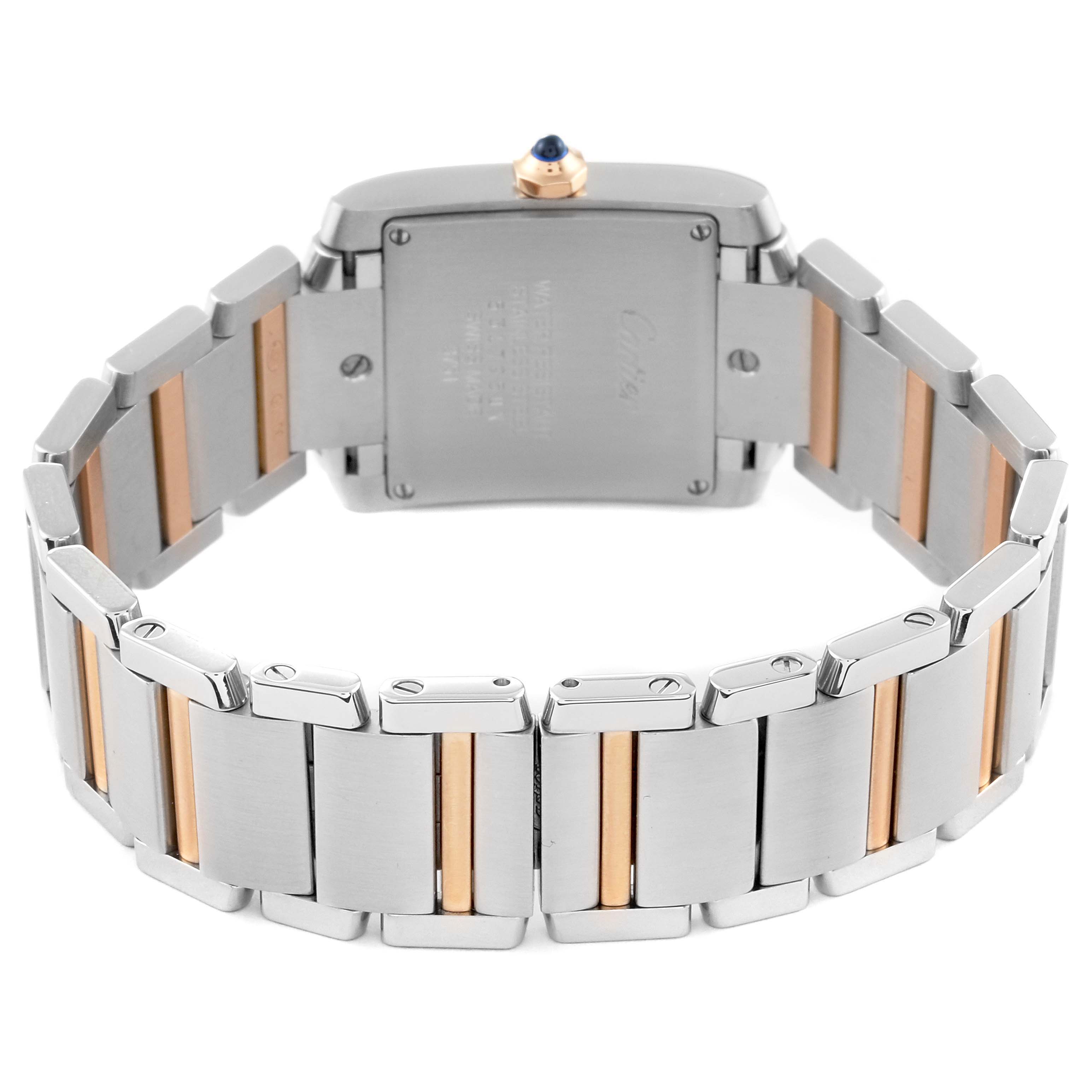 This image shows the Tank Francaise watch by Cartier from a rear angle, highlighting the two-tone metal bracelet and case back.