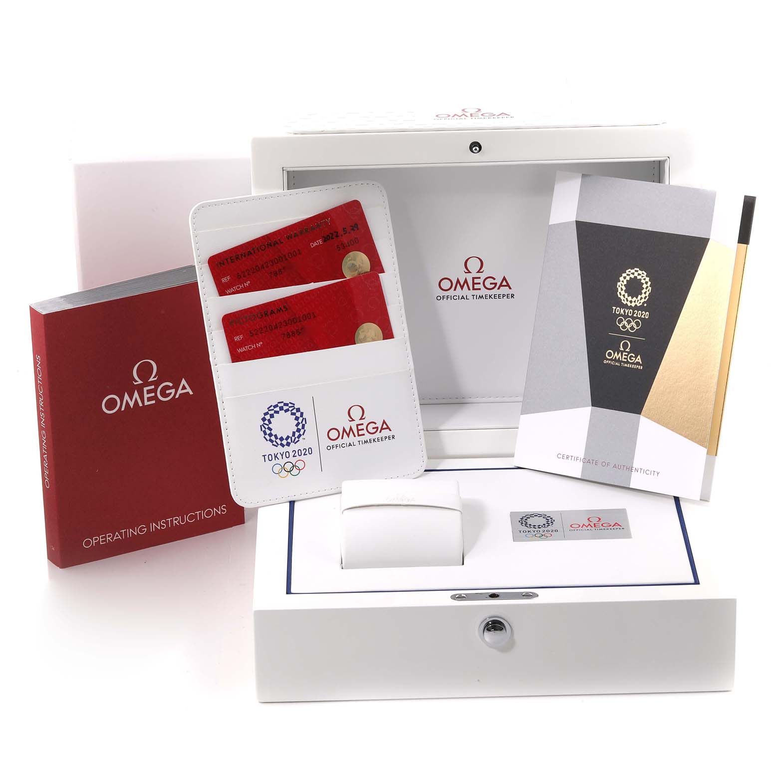 The image shows the packaging and accessories for the Omega Speedmaster 522.20.42.30.01.001 Men's Steel and Gold (two tone) Black Dial 522.20.42.30.01.001 Men's Steel and Gold (two tone) Black Dial watch, including manuals, warranty cards, and a box.