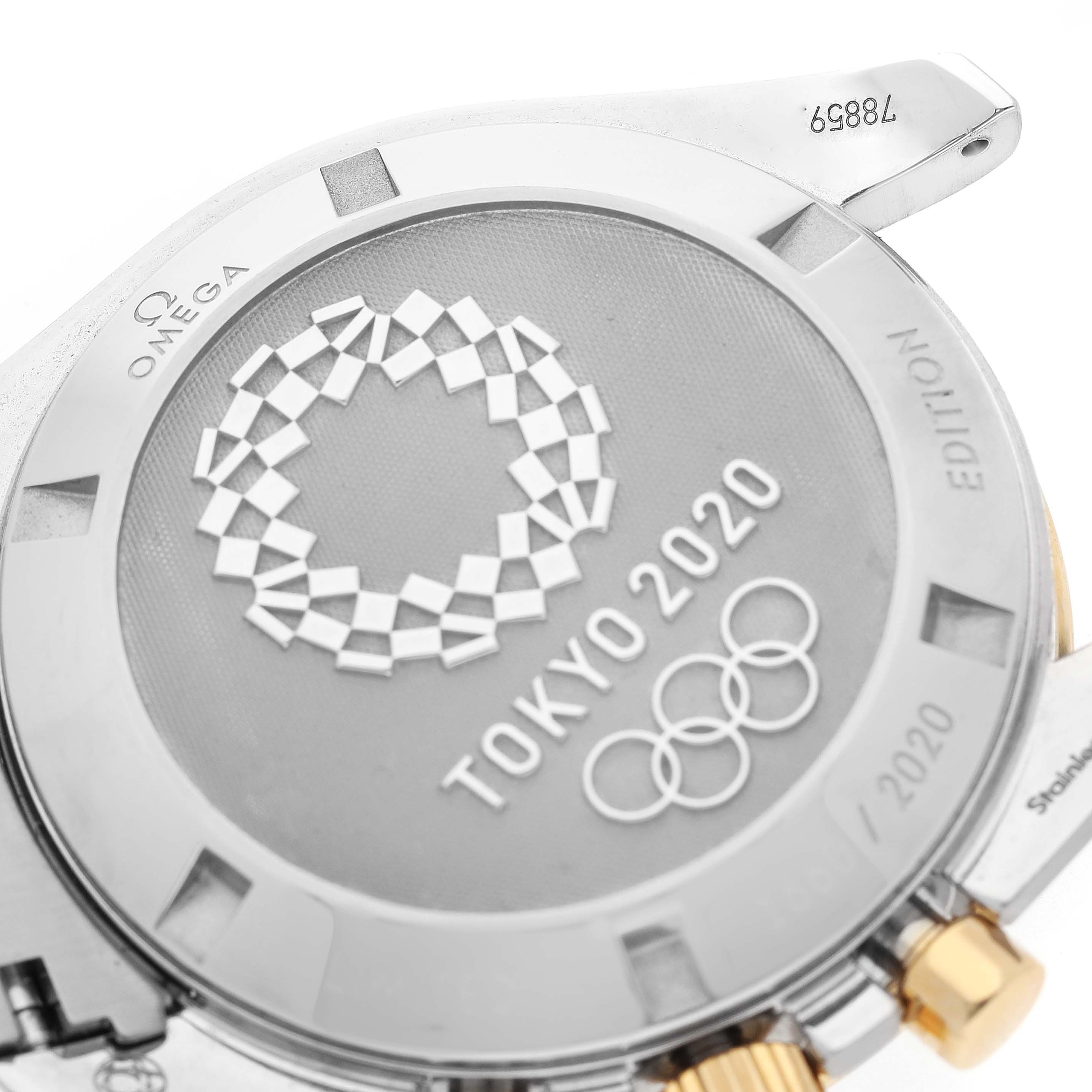 This image shows the case back of the Omega Speedmaster 522.20.42.30.01.001 Men's Steel and Gold (two tone) Black Dial 522.20.42.30.01.001 Men's Steel and Gold (two tone) Black Dial Tokyo 2020 Edition watch, featuring an engraved design and serial number.