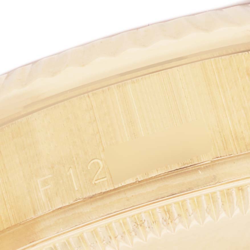 This image shows a close-up of the bezel and serial number area of a Rolex President 178278 Women's Yellow Gold Black Dial 178278 Women's Yellow Gold Black Dial model watch. 