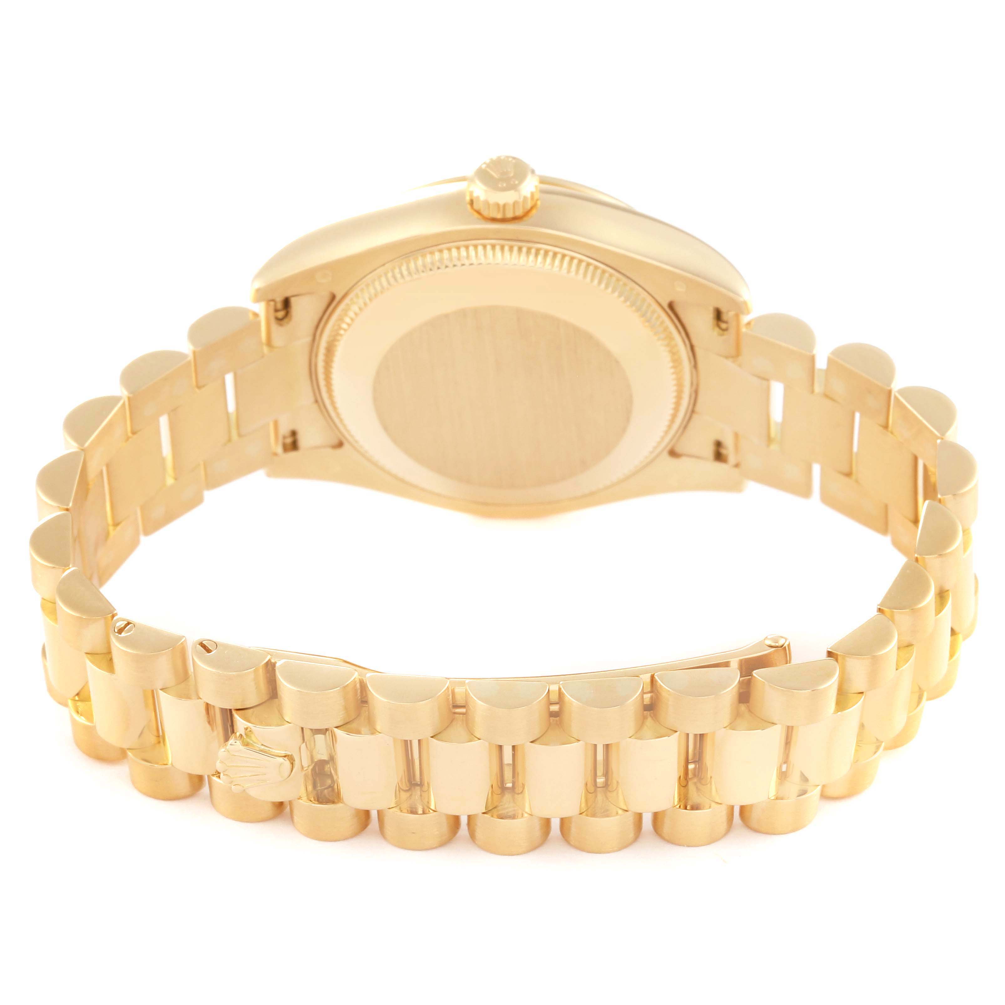 This image shows the case back and the bracelet of a Rolex President 178278 Women's Yellow Gold Black Dial 178278 Women's Yellow Gold Black Dial model watch from a rear angle.