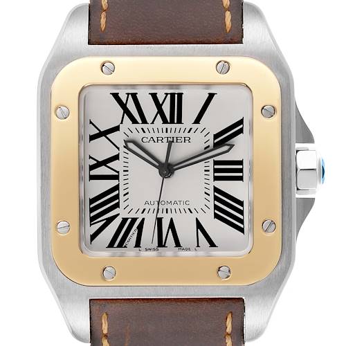 The Cartier Santos W20072X7 Men's Steel and Gold (two tone) Silver Dial W20072X7 Men's Steel and Gold (two tone) Silver Dial watch is shown from the front, highlighting the dial, case, and part of the leather strap.