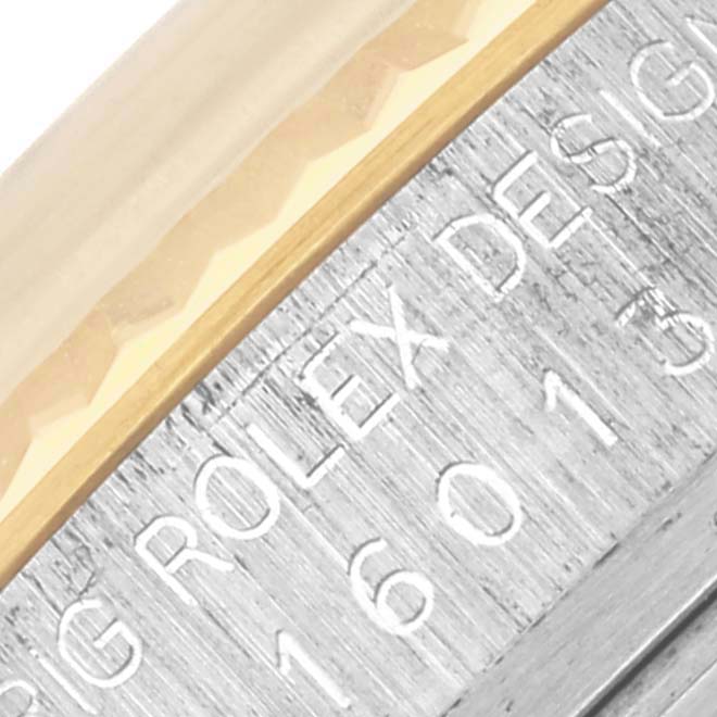 This image shows a close-up view of the Rolex Datejust 16013 Men's Steel and Gold (two tone) Champagne Dial 16013 Men's Steel and Gold (two tone) Champagne Dial's case side, highlighting the engraved model number.