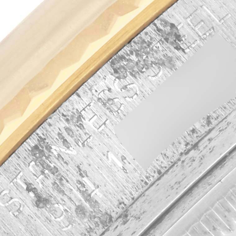 The image shows a close-up of the bezel and engraved part of a Rolex Datejust 16013 Men's Steel and Gold (two tone) Champagne Dial 16013 Men's Steel and Gold (two tone) Champagne Dial watch.