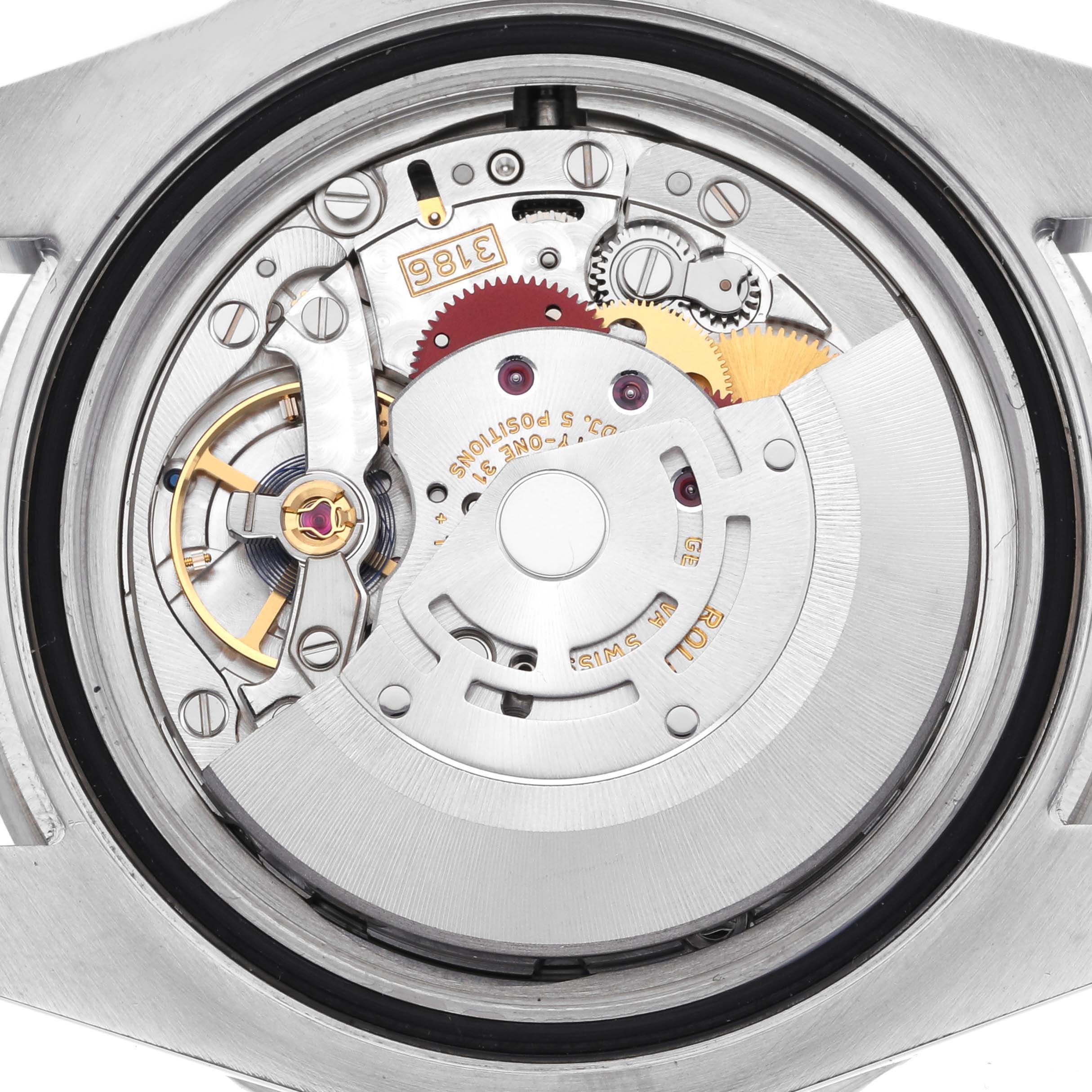 The image shows the movement of a Rolex GMT-Master 116710LN Men's Stainless Steel Black Dial 116710LN Men's Stainless Steel Black Dial watch from a top-down angle, highlighting gears and the rotor.