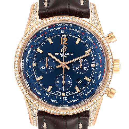 The image shows a front view of a Breitling Transocean RB0510 Men's Rose Gold Blue Dial RB0510 Men's Rose Gold Blue Dial watch with a blue dial, gold casing, diamond bezel, and a brown leather strap.