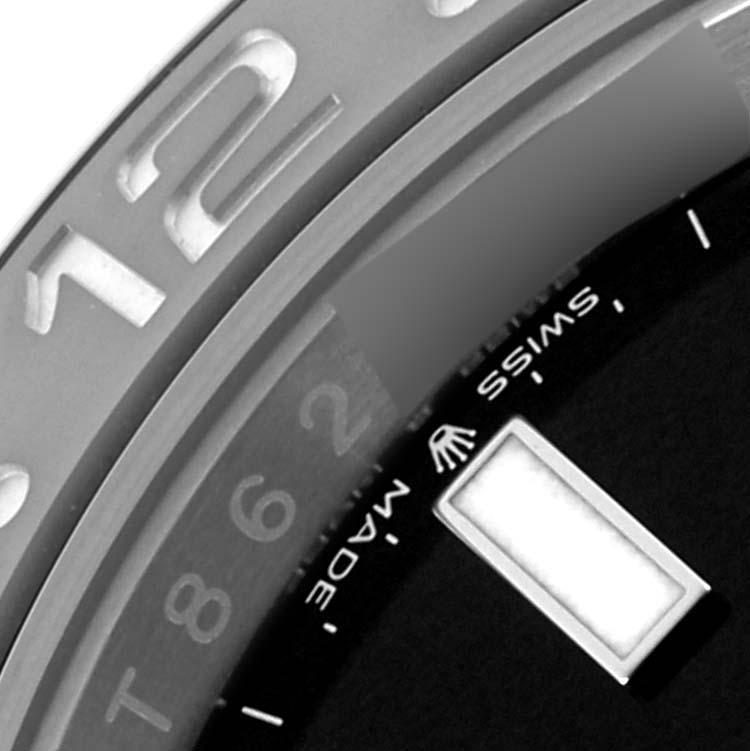 The image shows a close-up of the bezel and part of the dial of a Rolex GMT-Master 126710GRNR Men's Stainless Steel Black Dial 126710GRNR Men's Stainless Steel Black Dial watch.