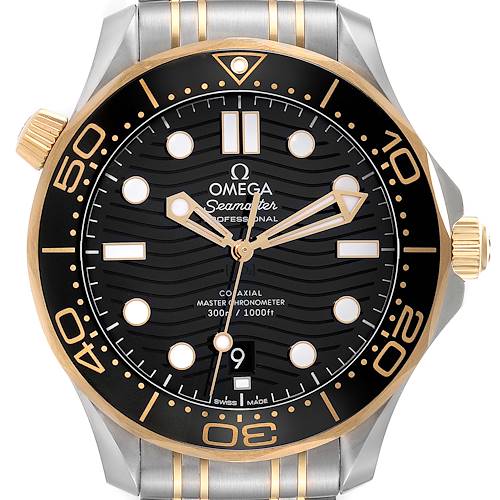 The image shows a front view of an Omega Seamaster 210.20.42.20.01.002 Men's Steel and Gold (two tone) Black Dial 210.20.42.20.01.002 Men's Steel and Gold (two tone) Black Dial watch, highlighting its dial, bezel, hands, and crown.