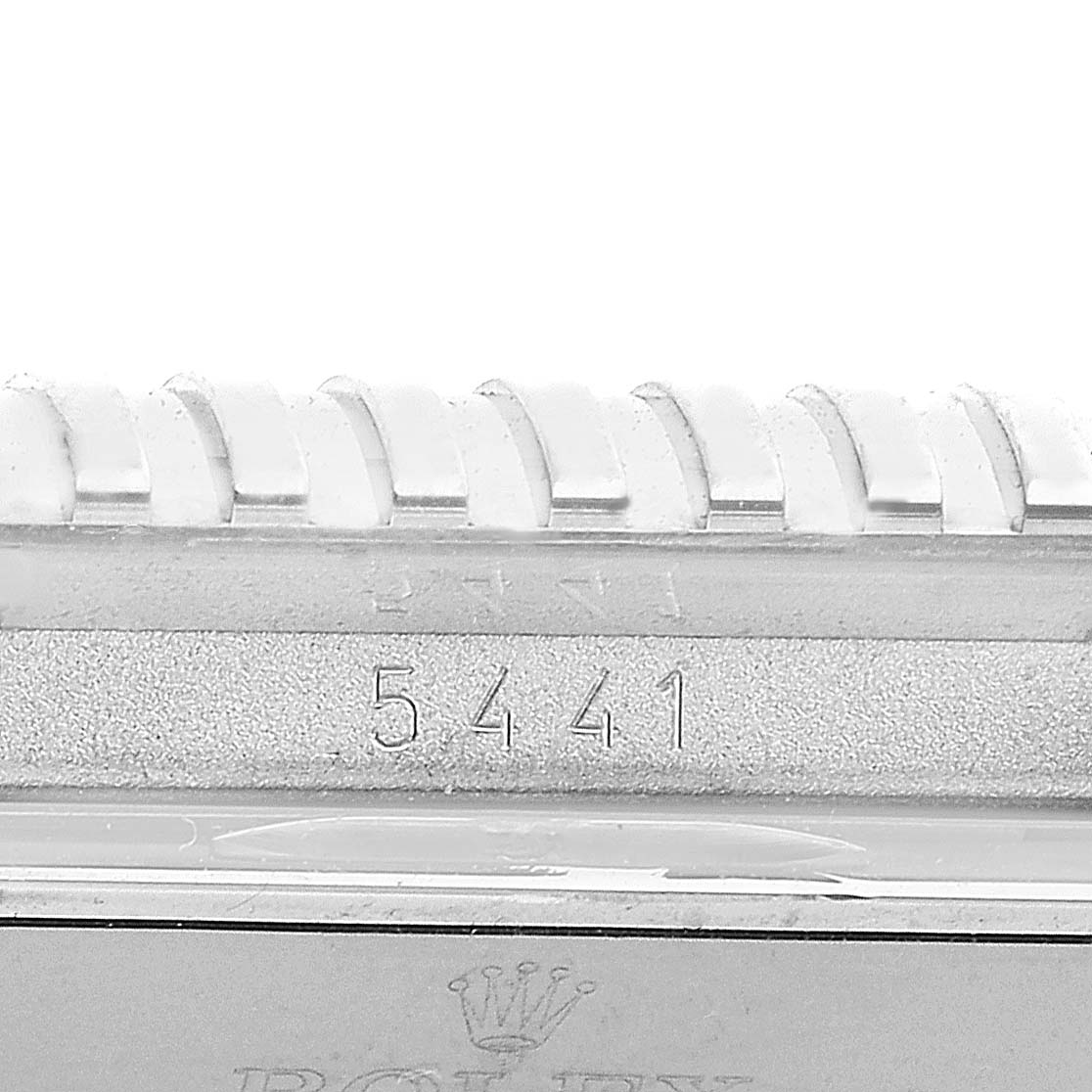 This close-up view shows the bezel details and serial number of the Rolex Cellini 5441/9 Men's White Gold Silver Dial 5441/9 Men's White Gold Silver Dial model watch.