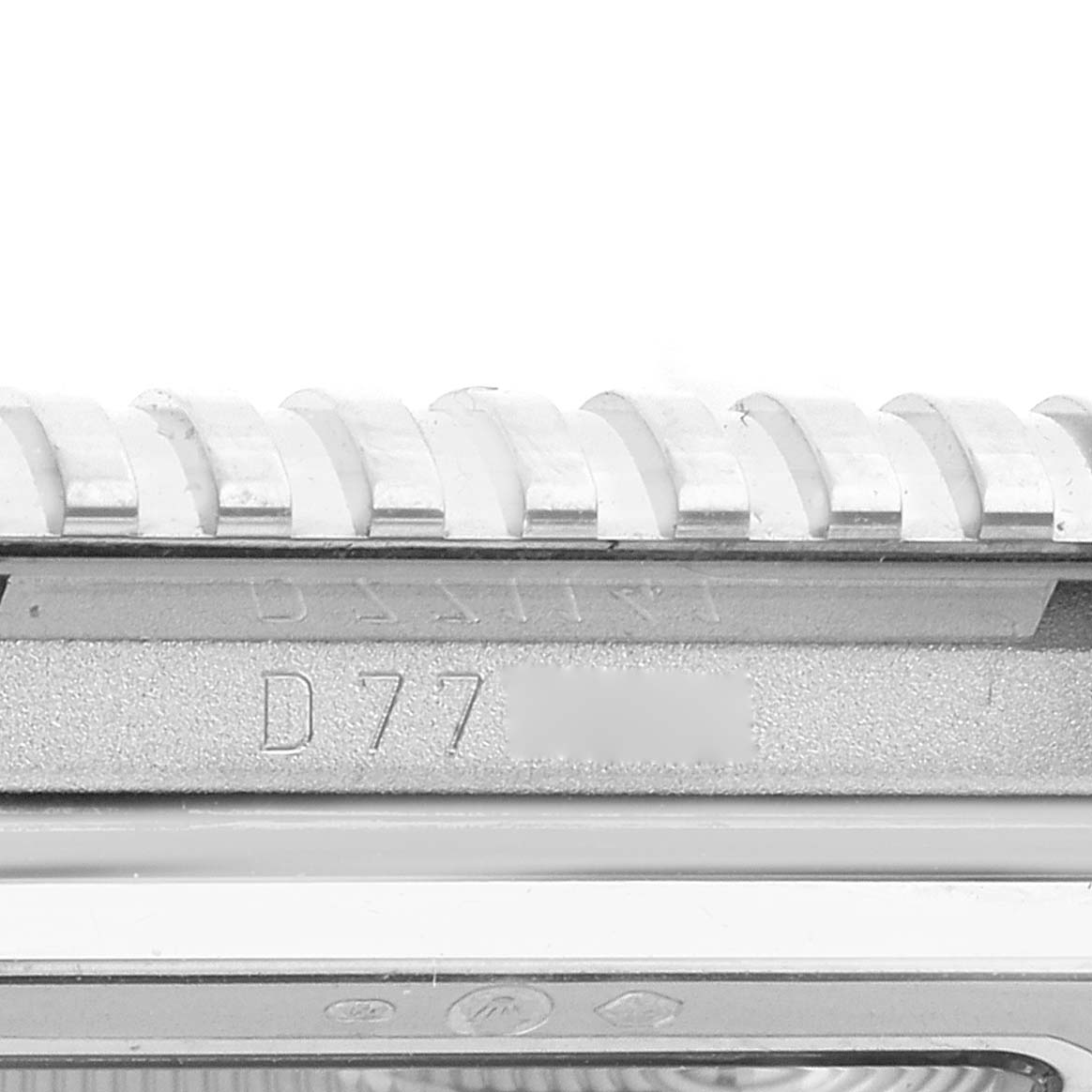 This image shows a close-up of the side of the bezel and serial number of a Rolex Cellini 5441/9 Men's White Gold Silver Dial 5441/9 Men's White Gold Silver Dial watch.