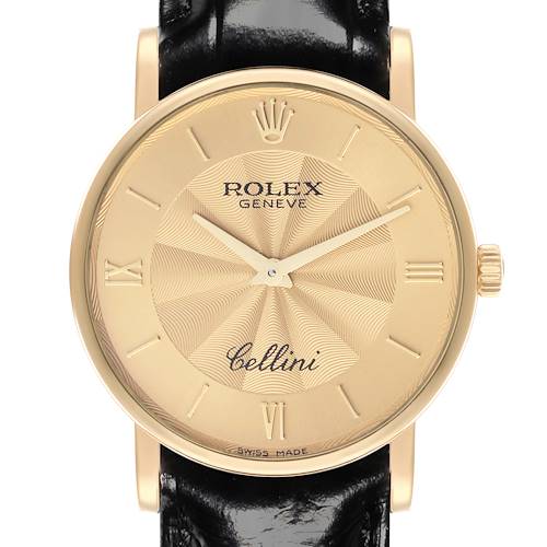 The Rolex Cellini 5115 Men's Yellow Gold Champagne Dial 5115 Men's Yellow Gold Champagne Dial watch is shown from a front angle, highlighting its gold dial, hands, Roman numerals, and black leather strap.