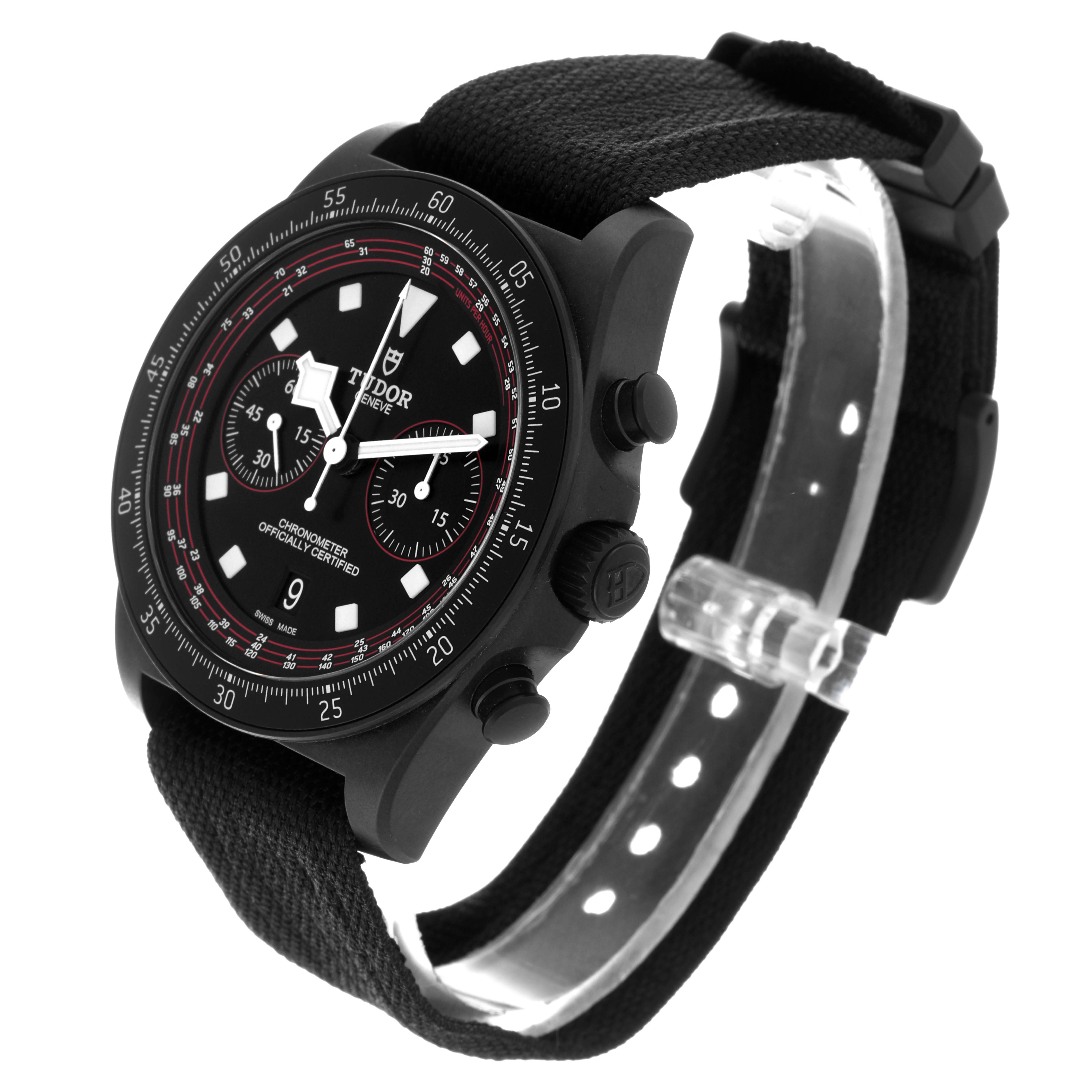 The image shows a Tudor watch from a side angle, highlighting the dial, bezel, and strap.