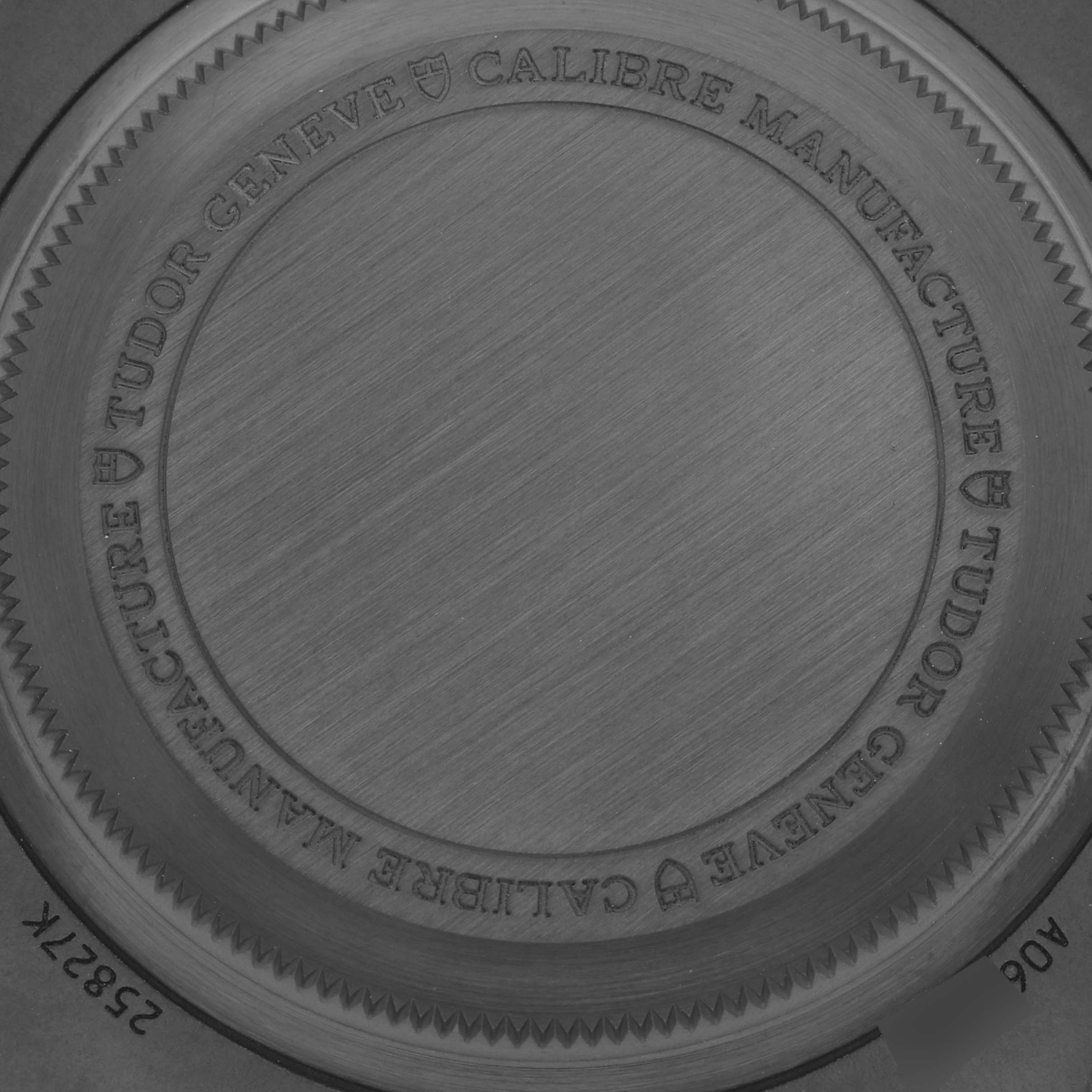 The image shows the case back of a Tudor Pelagos 25827KN Men's Ceramic Black Dial 25827KN Men's Ceramic Black Dial watch, highlighting its engraved details and brushed metal texture.