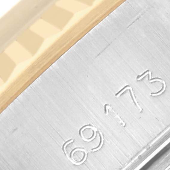 The image shows a close-up of the edge with the reference number and part of the Rolex Datejust 69173 Women's Steel and Gold (two tone) Champagne Dial 69173 Women's Steel and Gold (two tone) Champagne Dial's fluted bezel.