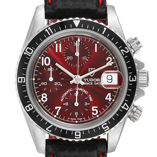 This image shows a front-angle view of the Tudor Tiger 79270 Men's Stainless Steel Burgundy Dial 79270 Men's Stainless Steel Burgundy Dial watch with a red dial, black bezel, silver case, and leather strap.