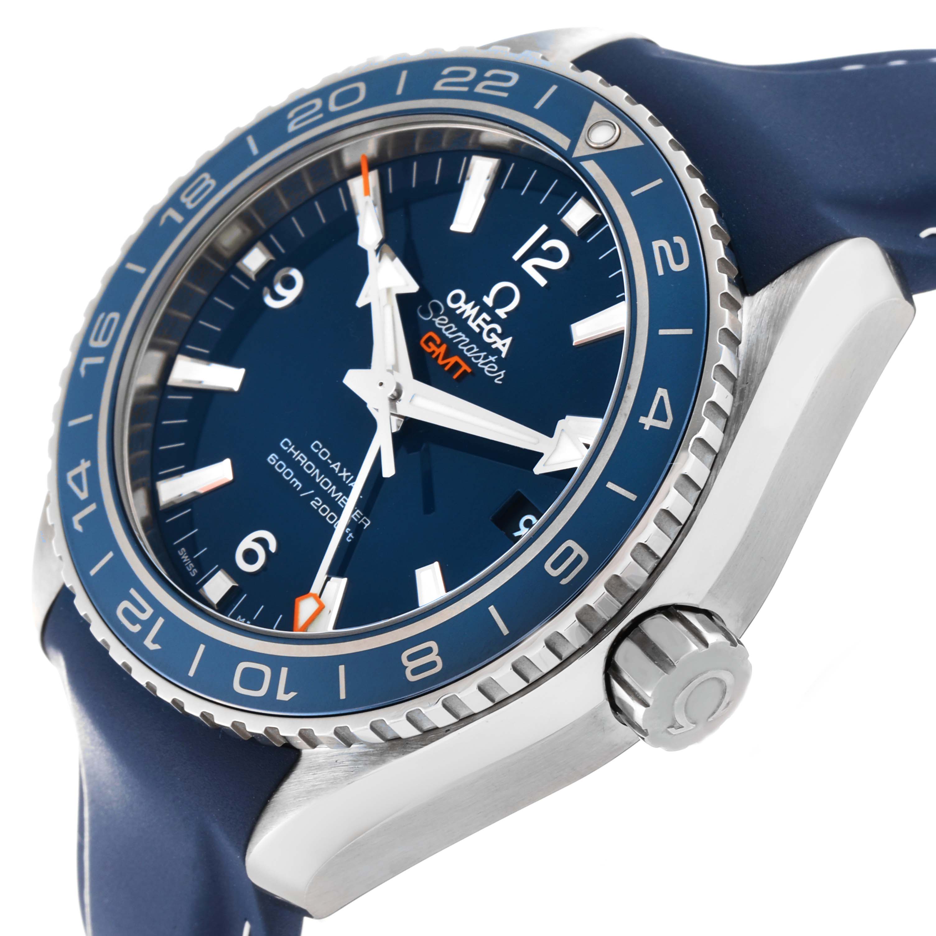 The image shows a close-up angle of the Omega Planet Ocean 232.92.44.22.03.001 Men's Titanium Blue Dial 232.92.44.22.03.001 Men's Titanium Blue Dial GMT watch, highlighting its bezel, crown, and part of the blue strap.