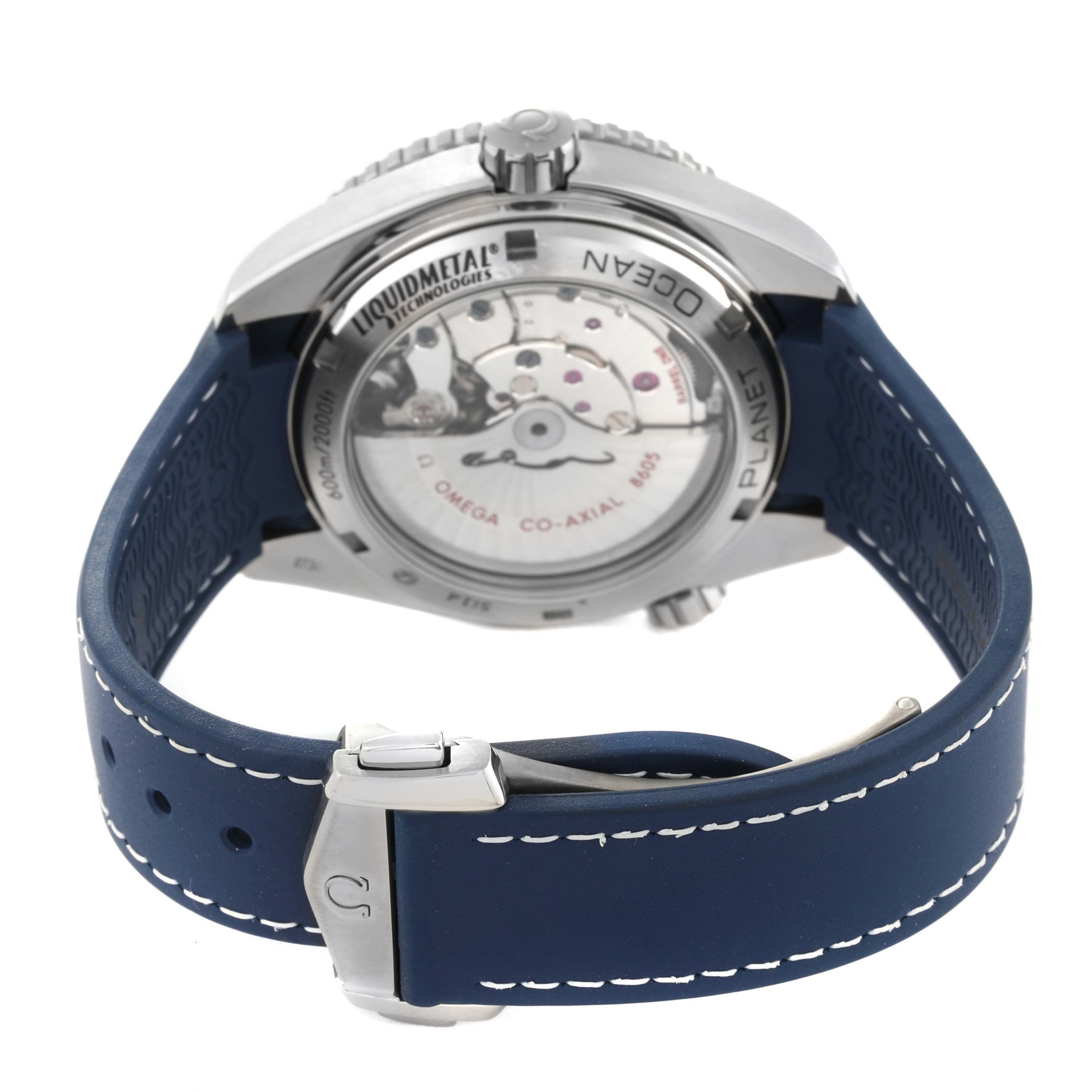 The image shows the back case and blue strap of the Omega Planet Ocean 232.92.44.22.03.001 Men's Titanium Blue Dial 232.92.44.22.03.001 Men's Titanium Blue Dial watch, highlighting the transparent case back and clasp.