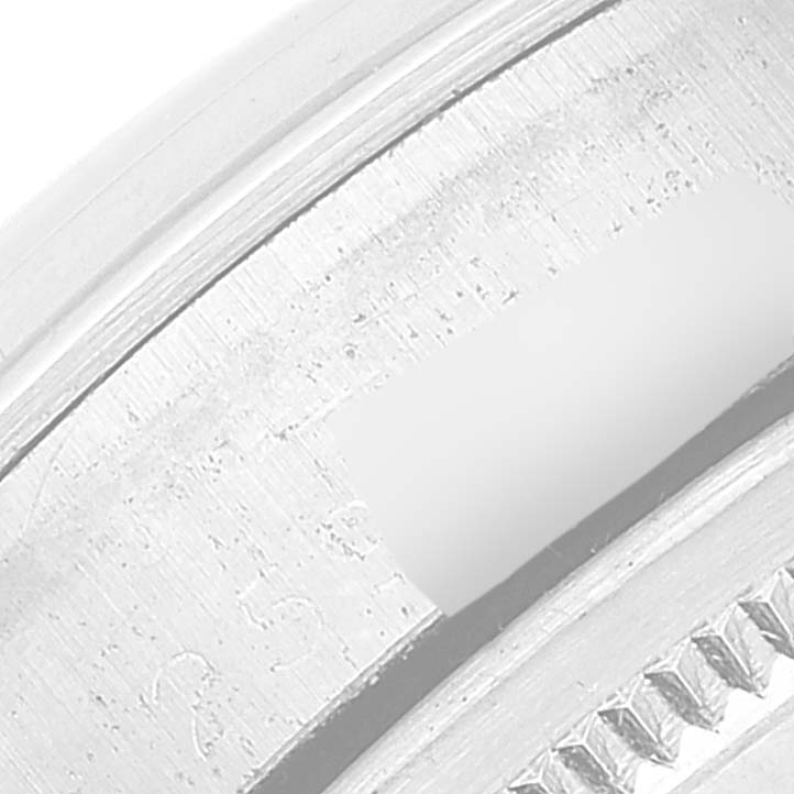 The image shows a close-up of the bezel and part of the case for a Rolex Date 1500 Men's Stainless Steel Silver Dial 1500 Men's Stainless Steel Silver Dial watch.