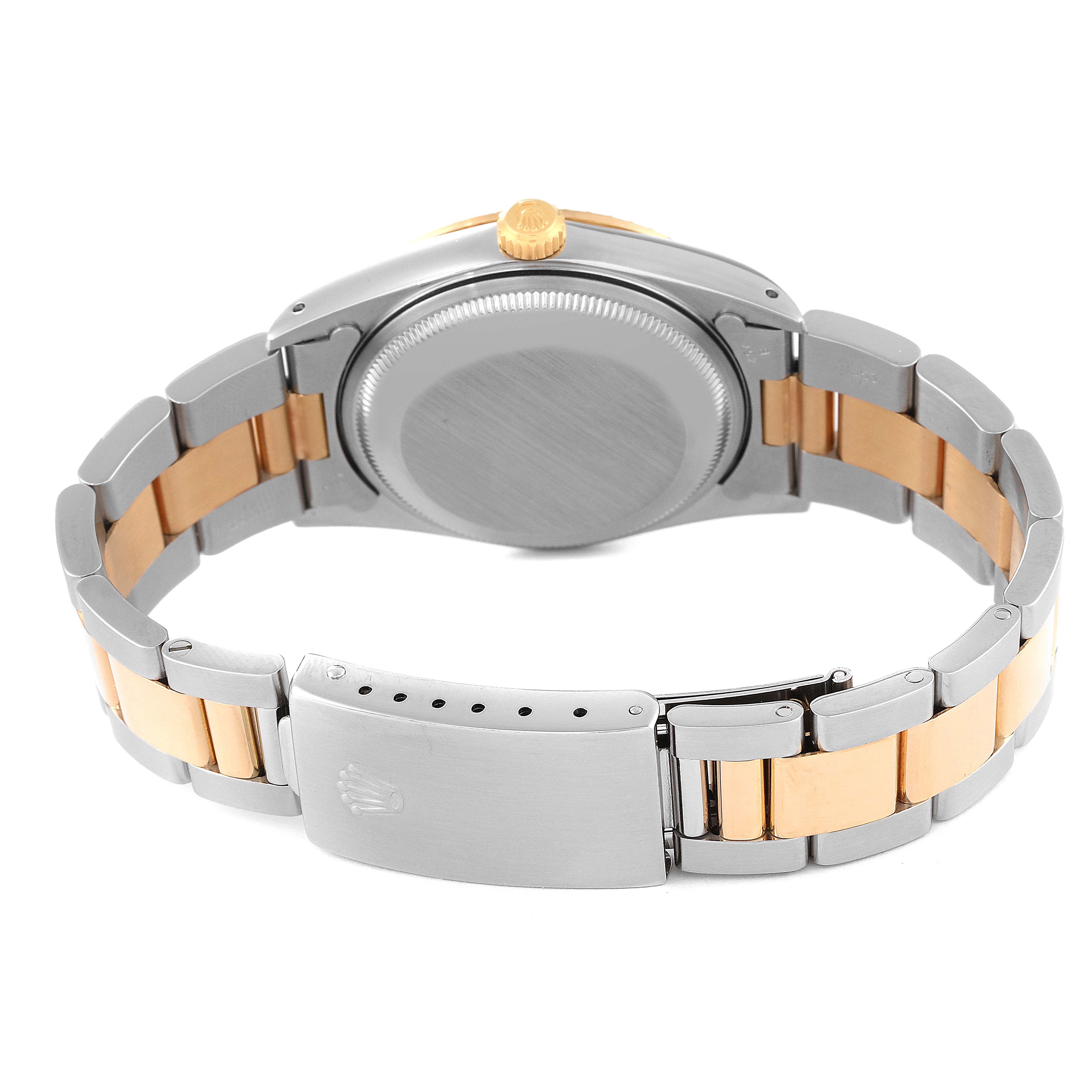 This image shows the back and bracelet of a Rolex Date 15223 Men's Steel and Gold (two tone) Champagne Dial 15223 Men's Steel and Gold (two tone) Champagne Dial model watch, highlighting its clasp and caseback.